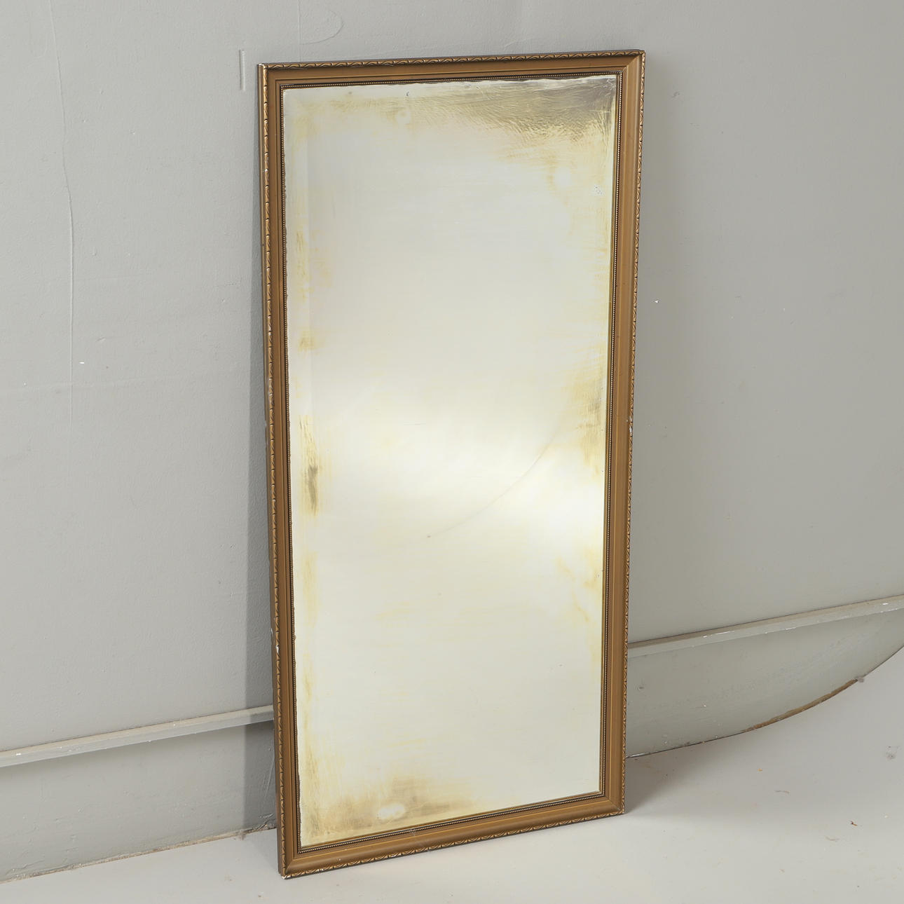 A mirror, painted wood, 20th century.