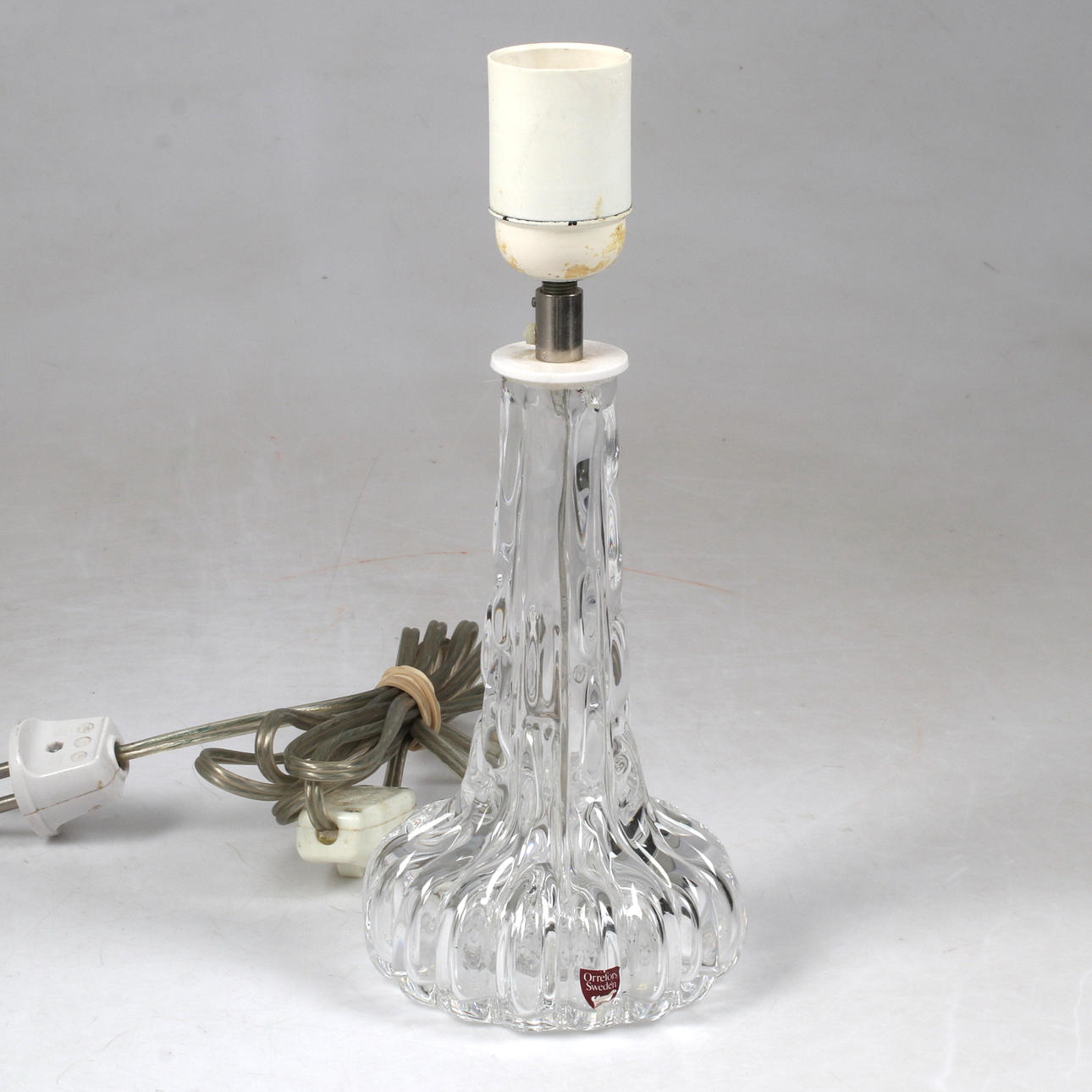 A glass table lamp, probably Carl Fagerlund, Orrefors.