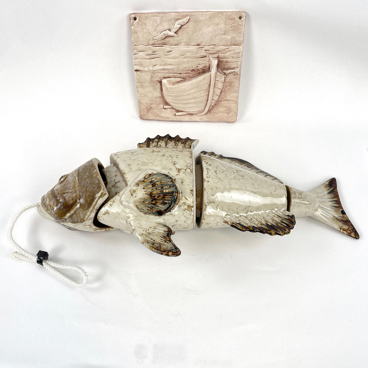 FOUR PIECE FISH and WALL RELIEF. Glazed ceramics.