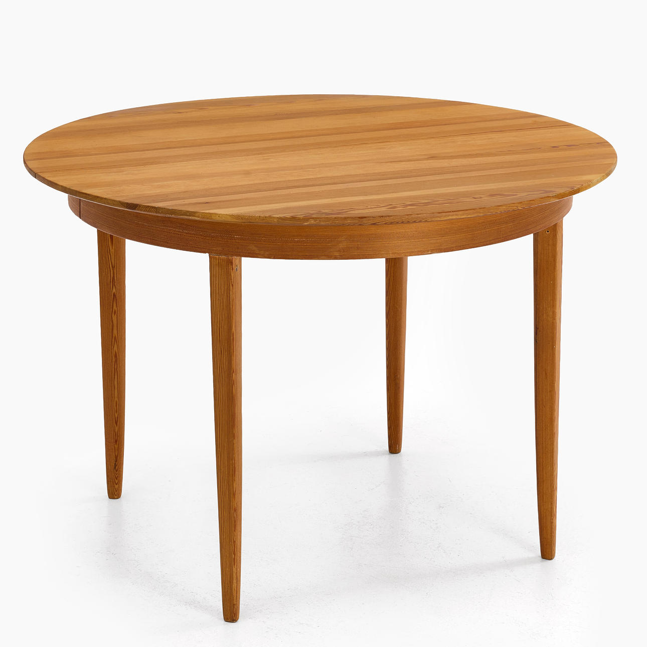 CARL MALMSTEN (1888—1972). “Round June” dining table, 1940s/50s, pine. round divisible disc, straight legs, branded CM.
