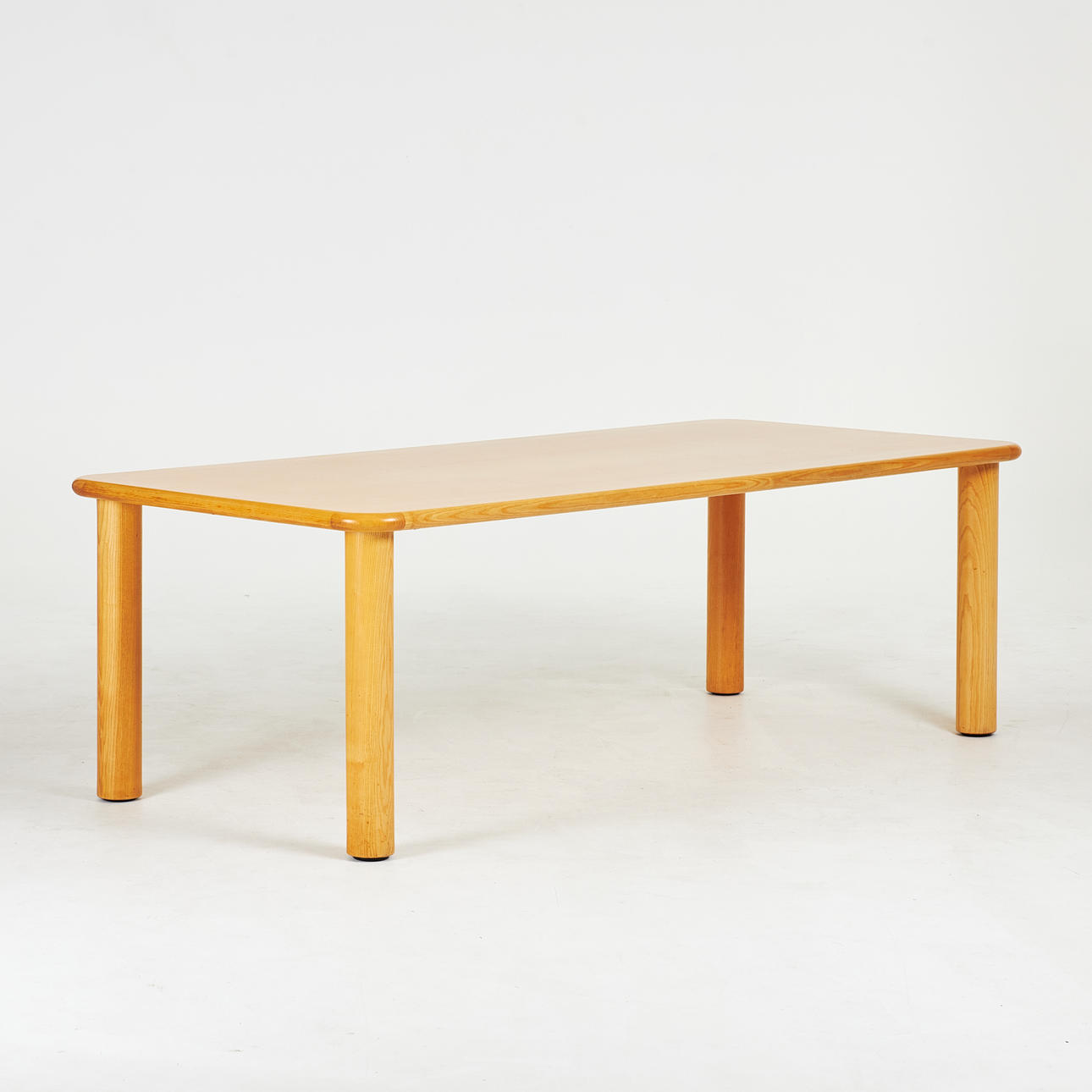 A dining table, ash veneer, rounded edges, second half of the 20th century.