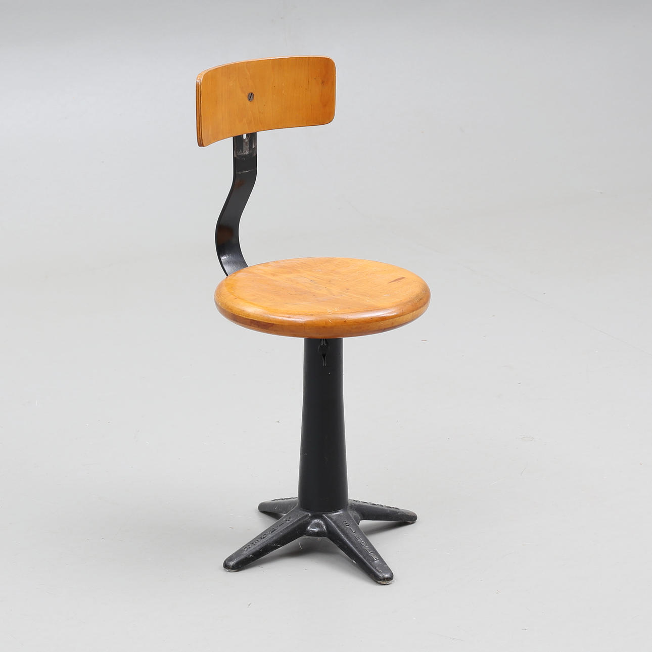 An industrial-design Singer iron/wood chair, first half of the 20th ...