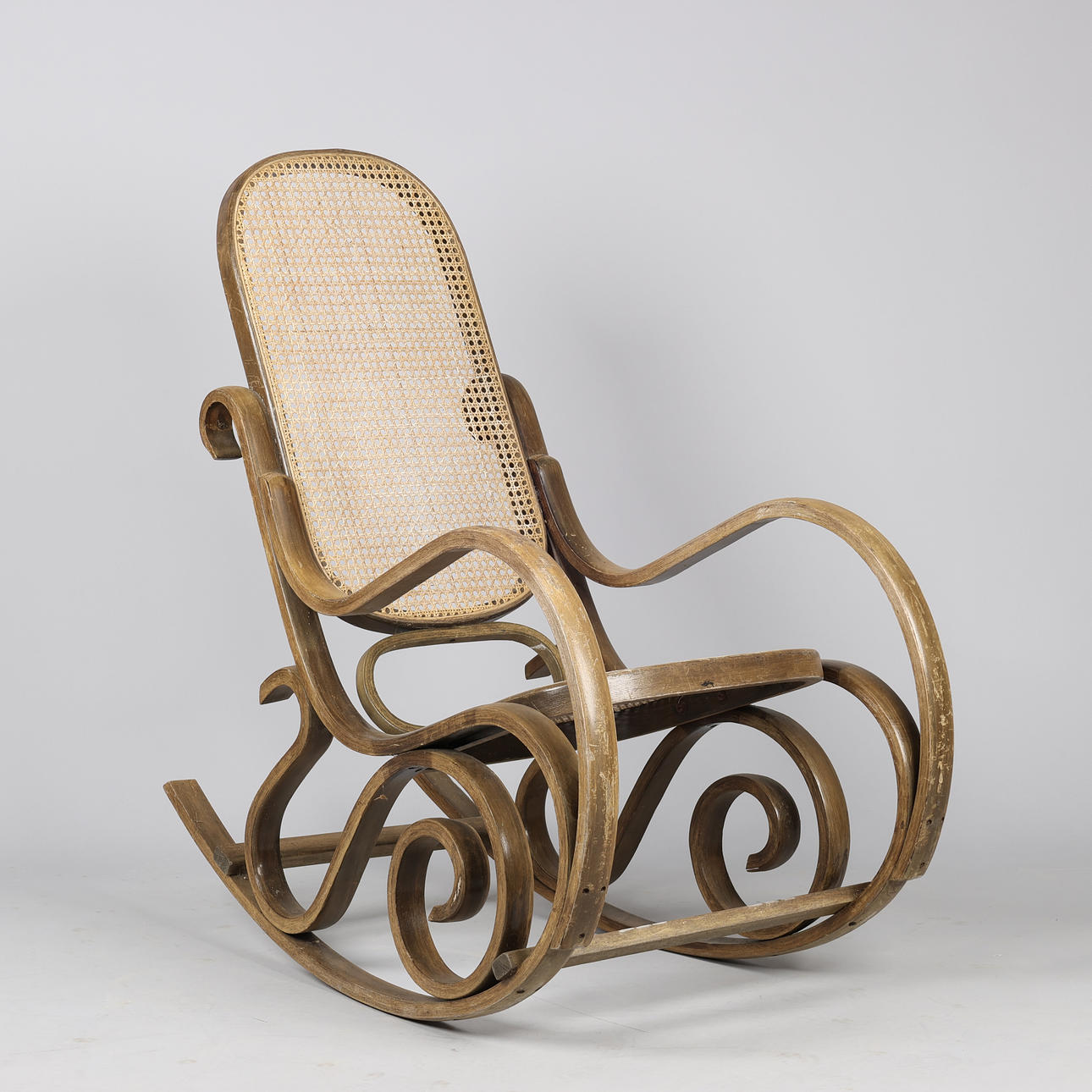 Rocking chair in stained wood with seat and back of French wicker ...