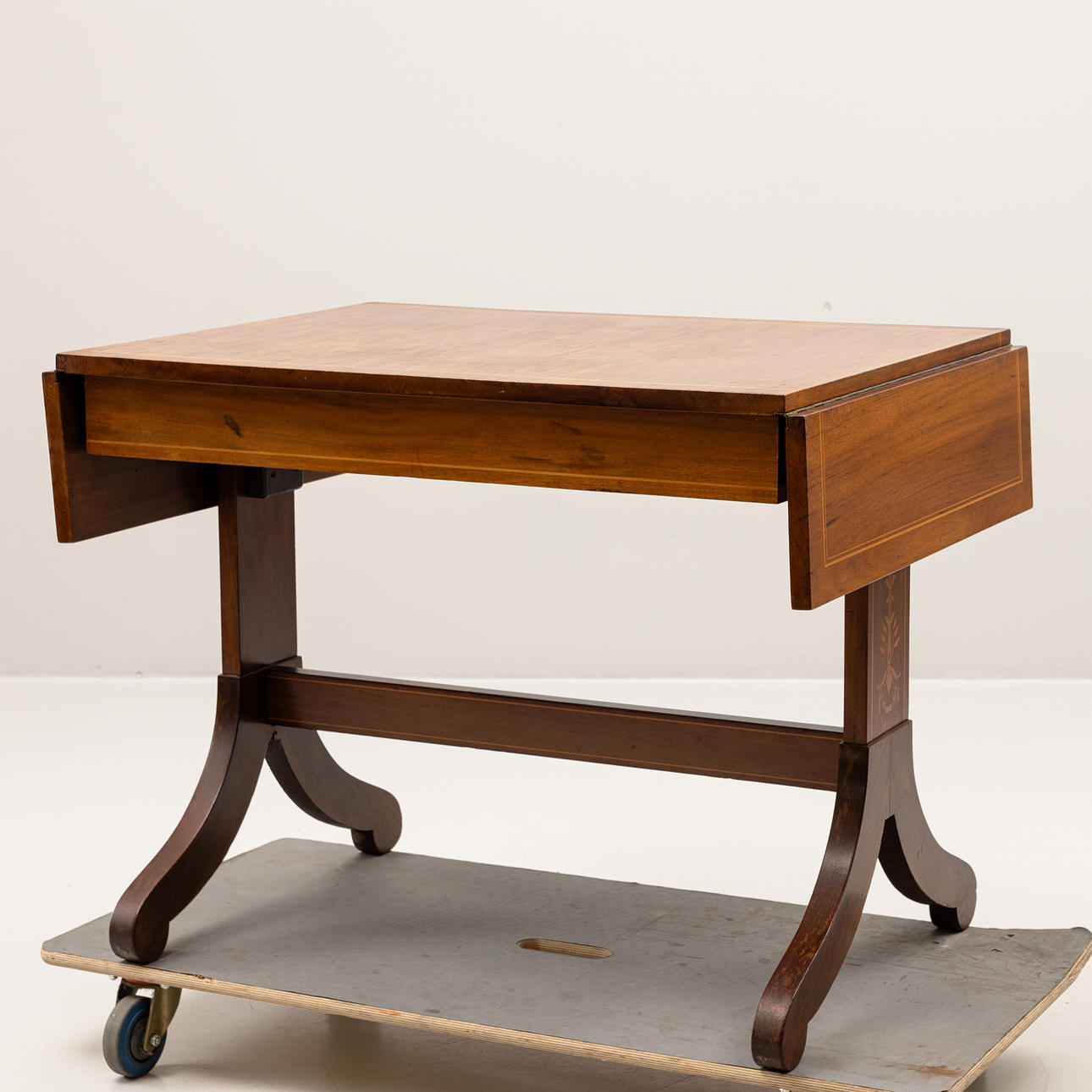 An Empire style mahogany folding table, 20th century.