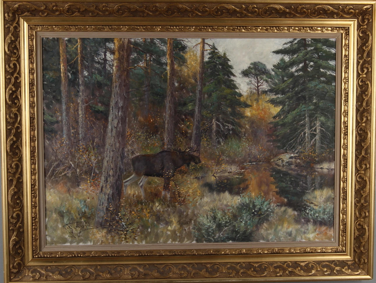 JOHANNES RAVN. Skogslandskap med älgtjur, olja på duk, signerad.