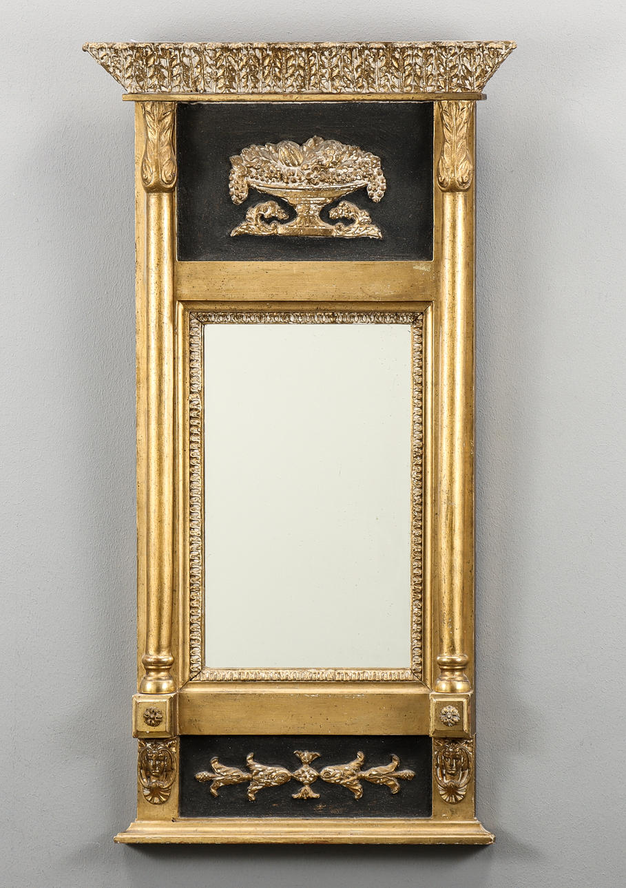 WALL MIRROR Empire, gilded with blackened details.