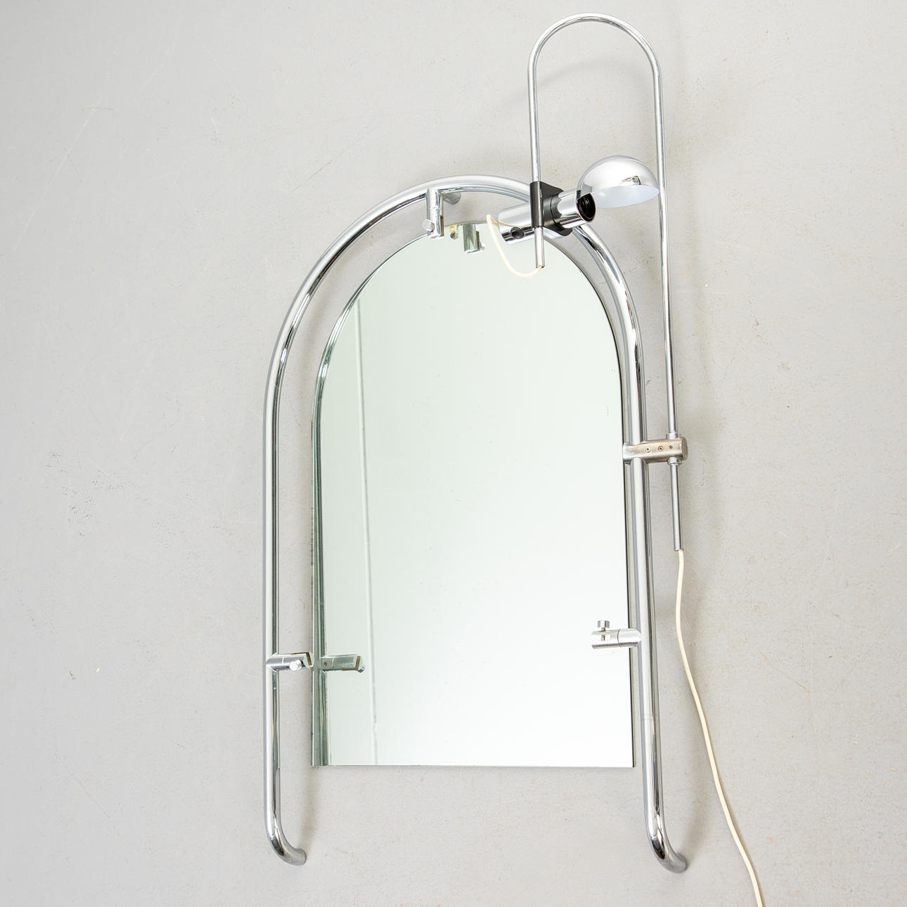 Chrome bathroom mirror with adjustable light, 1970s.