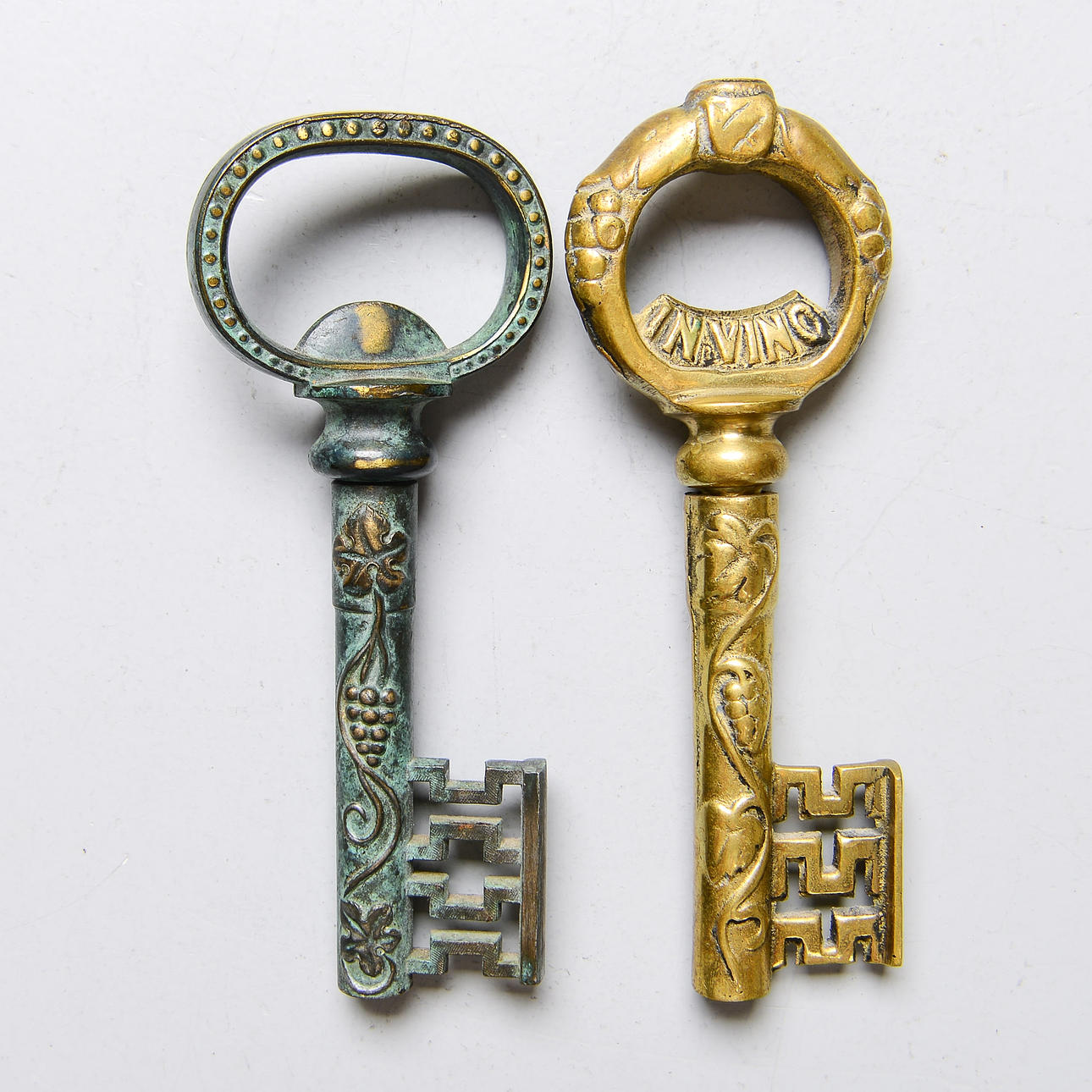 Two brass bottle openers, late 20th century.