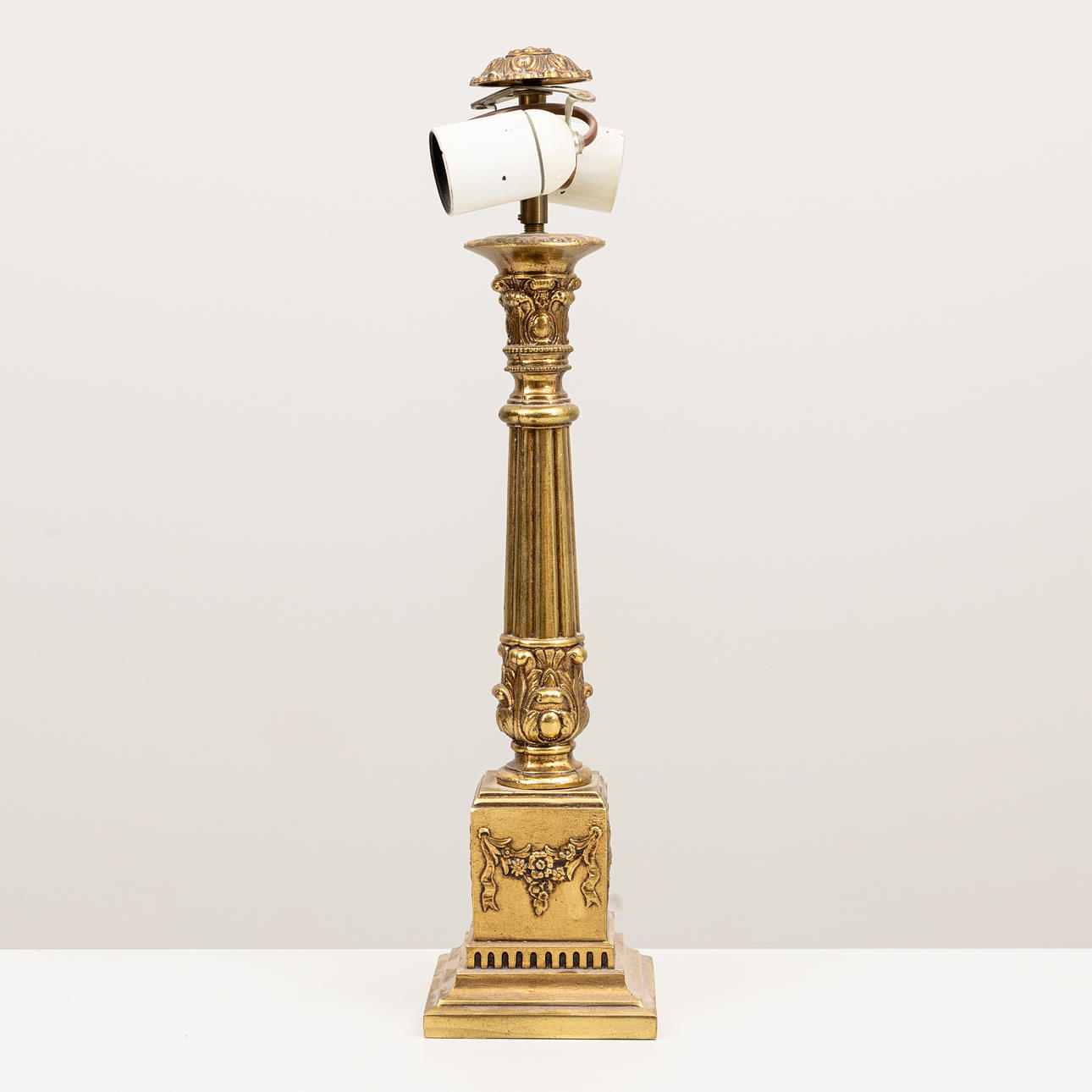 A lamp base, yellow metal, 20th century.
