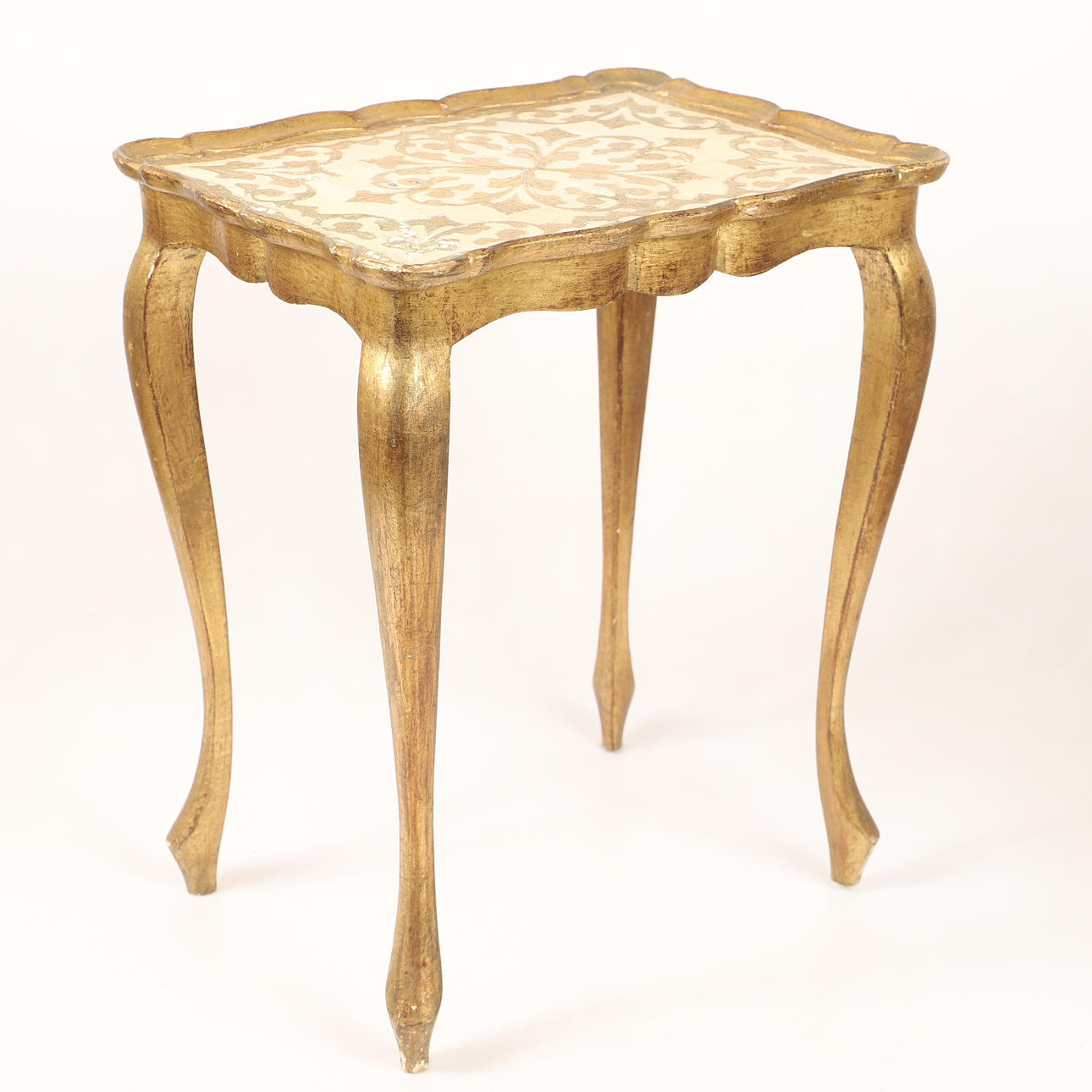 A side table, gilded wood with leaf decor, 20th century.