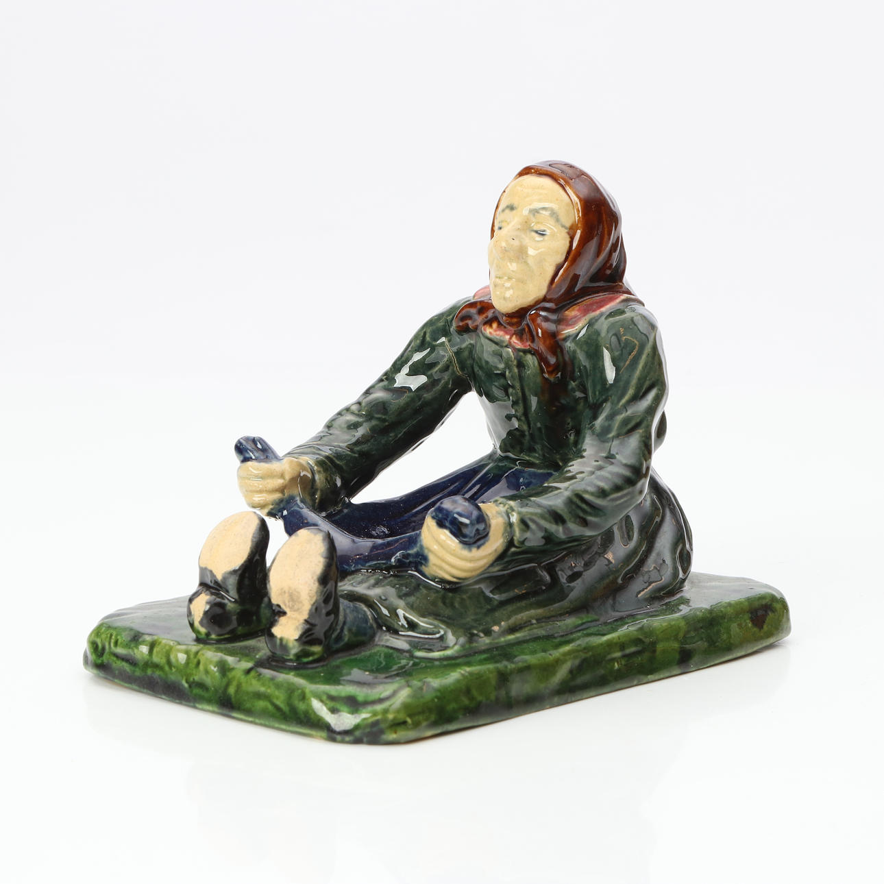 HIGH, FIGURINE. Majolica. “Pålstorperskan”. Marked underneath.