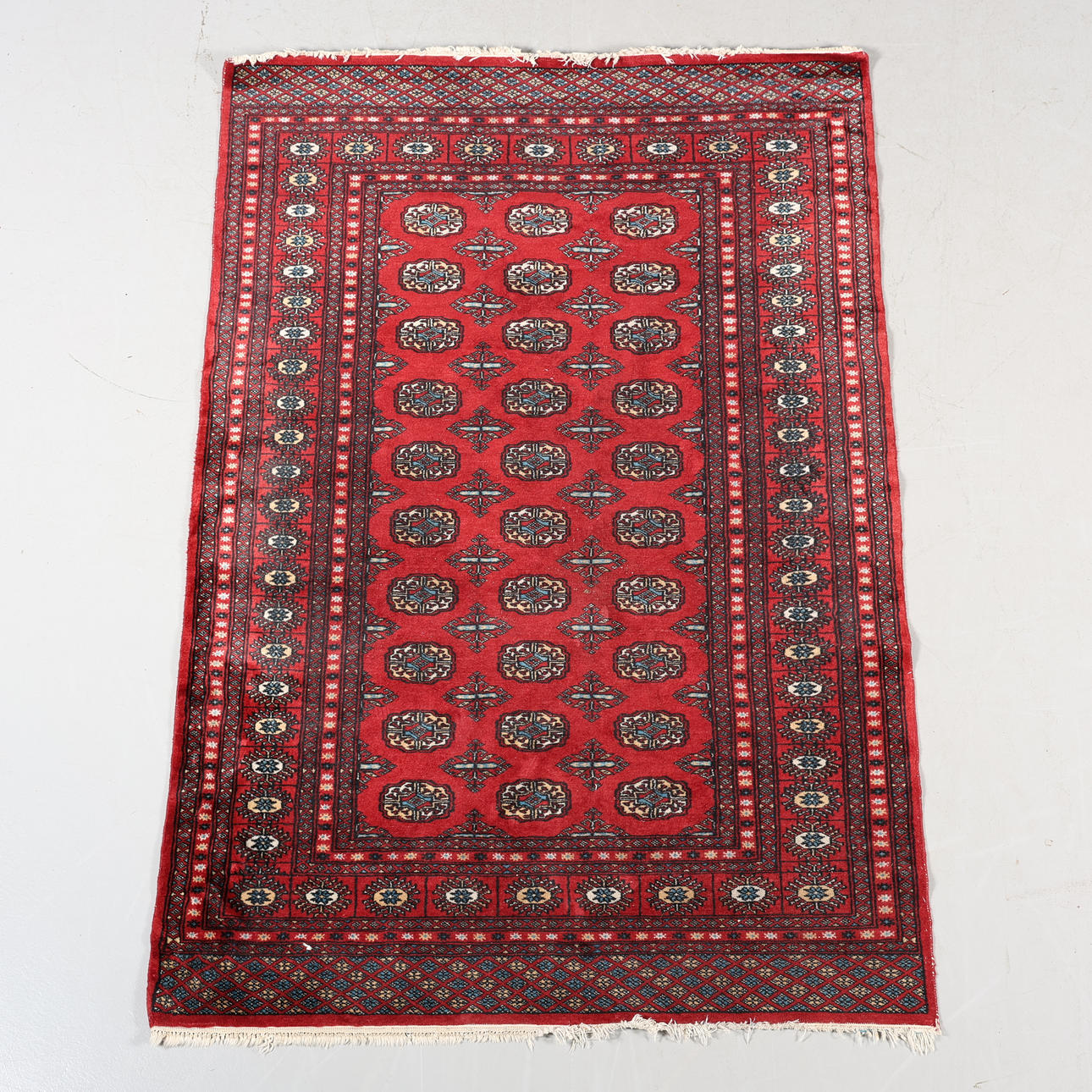 A CARPET, hand-knotted, 192 x 128 cm.