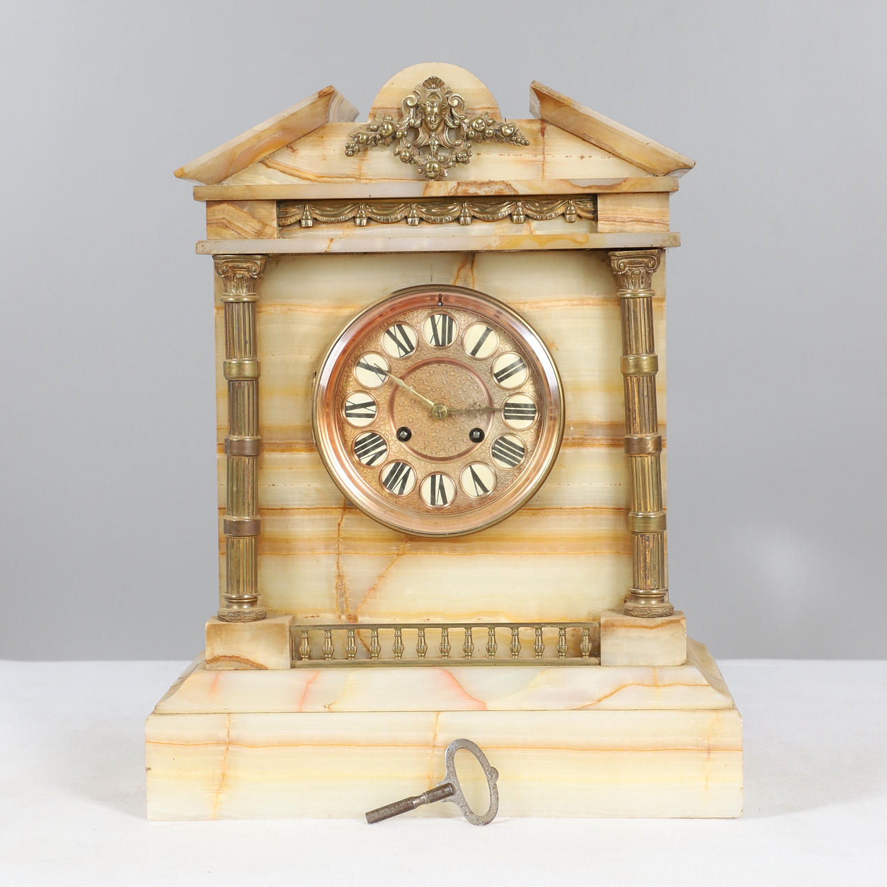 A VICTORIAN ONYX EIGHT DAY MANTEL CLOCK.