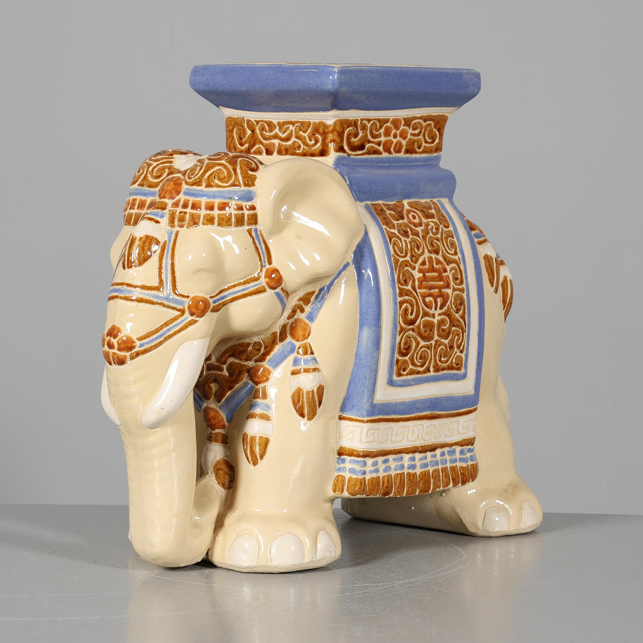 A ceramic pedestal, elephant.