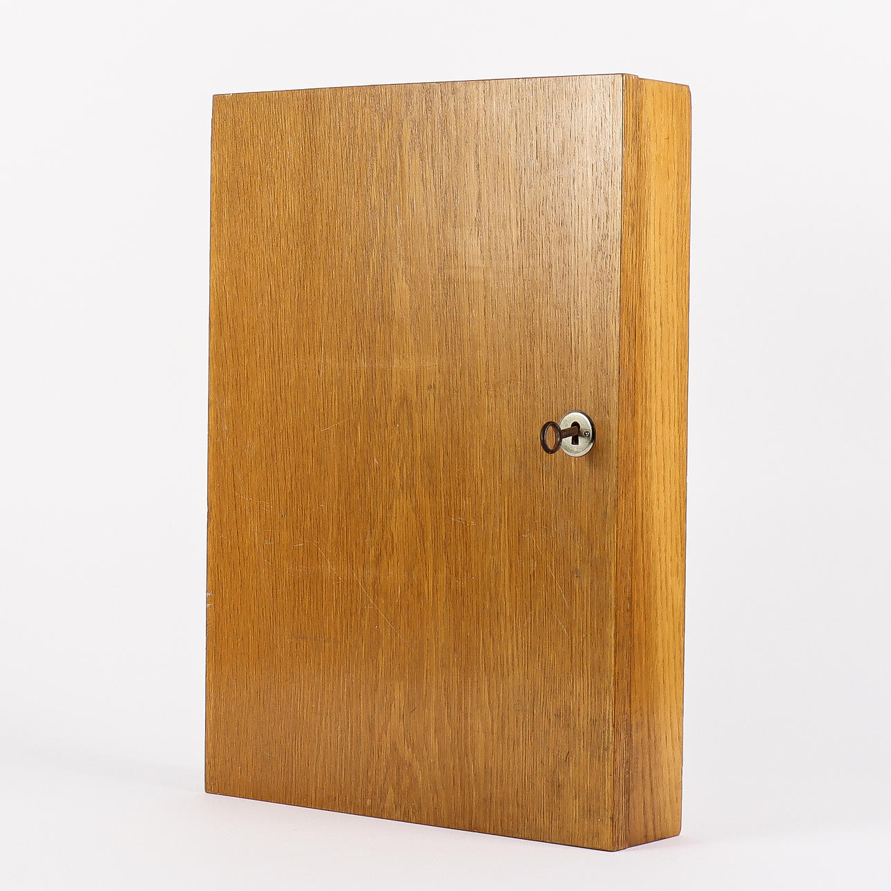 A 1950s/60s oak key cabinet.