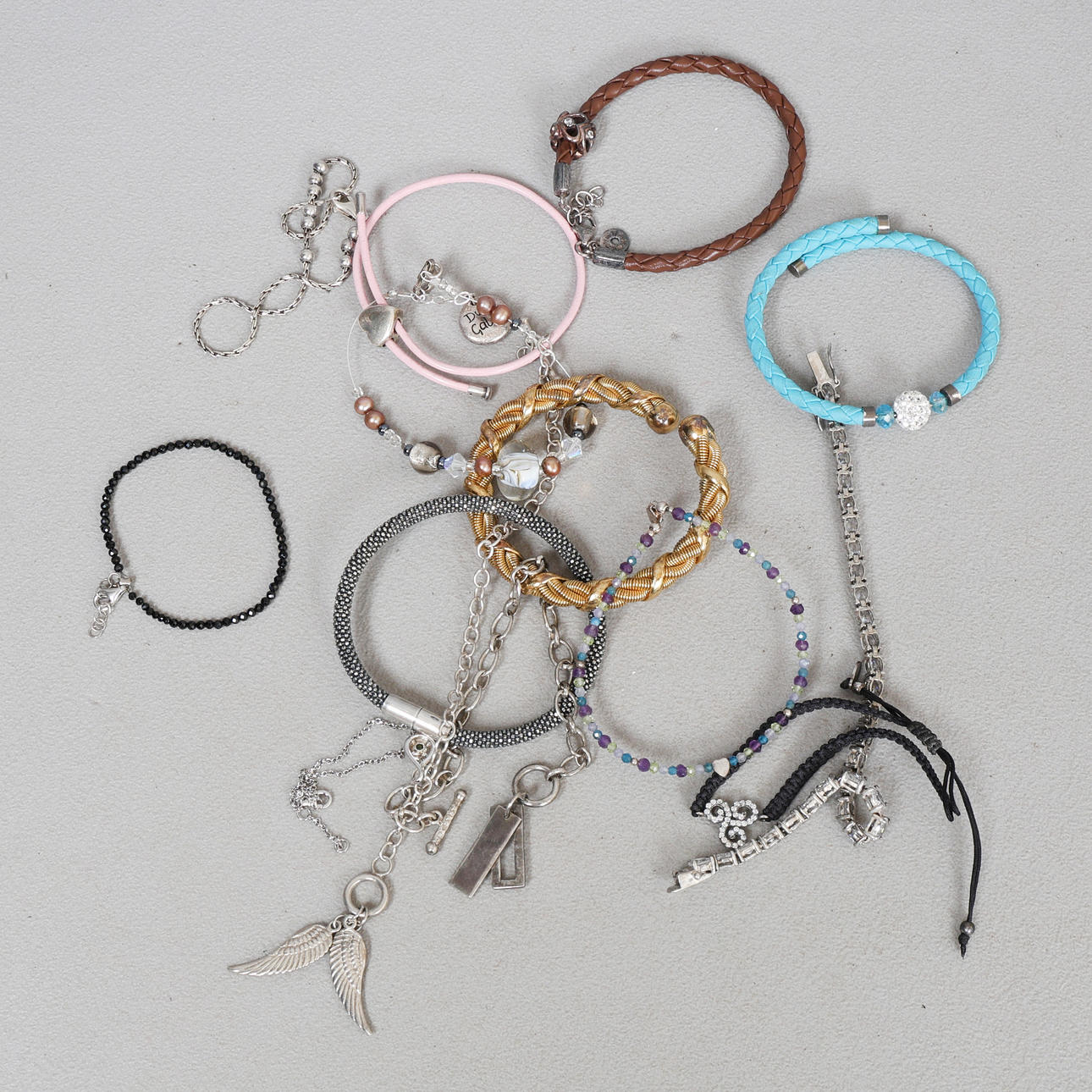 A COLLECTION OF SILVER BRACELETS (QTY).