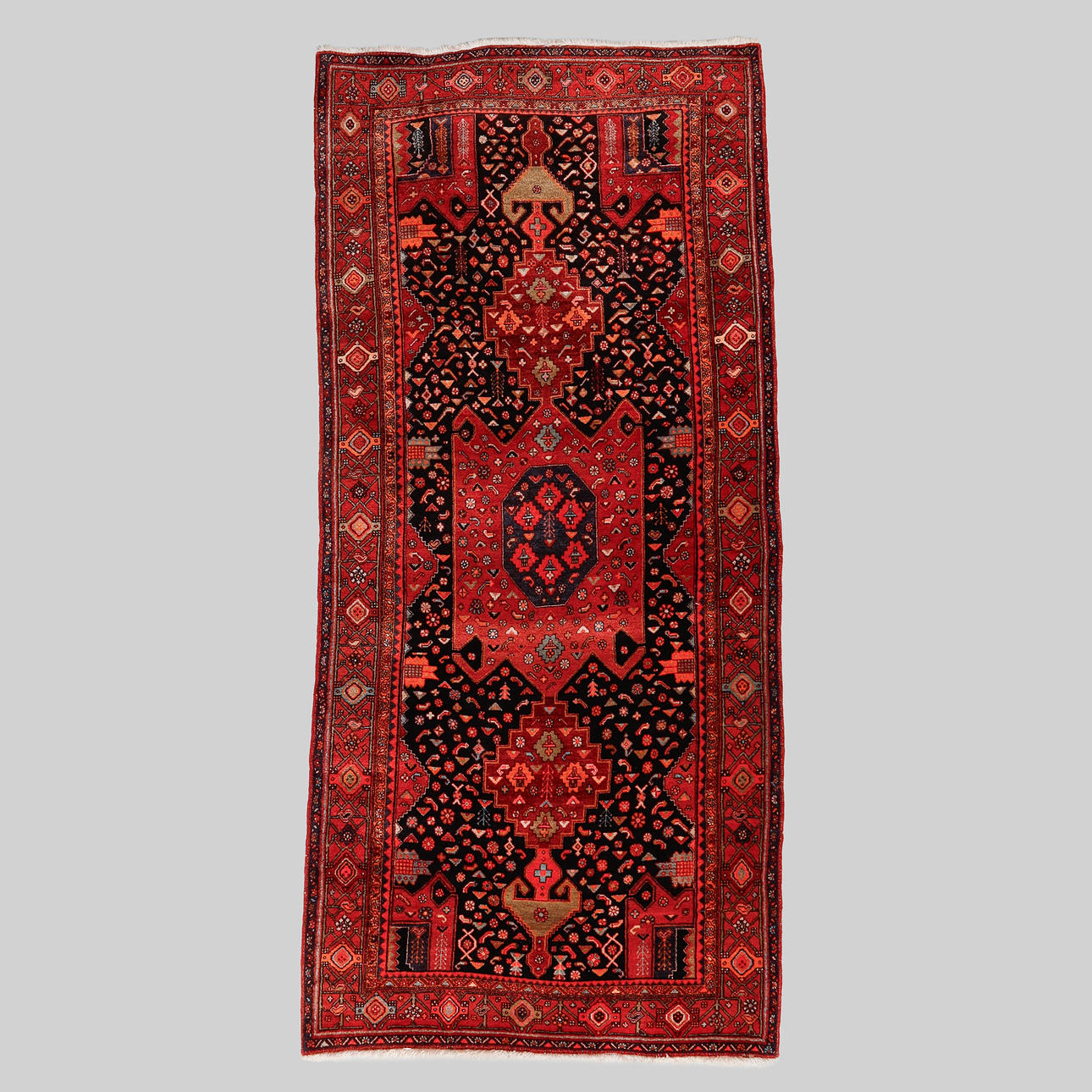 A CARPET, Persian, 325 x 149 cm.