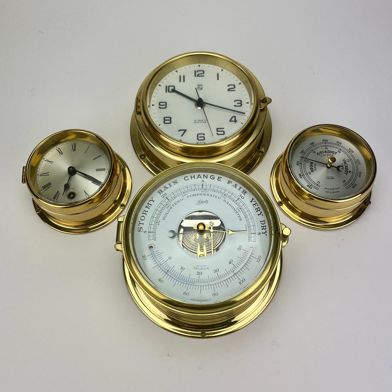WALL CLOCK AND BAROMETERS, 4 pieces, brass, including Schatz, Philips.