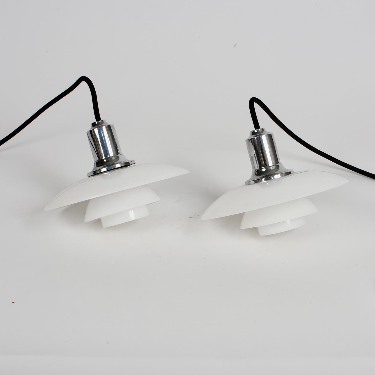 POUL HENNINGSEN. Louis Poulsen, A pair of PH2/1 opal glass and chrome ...