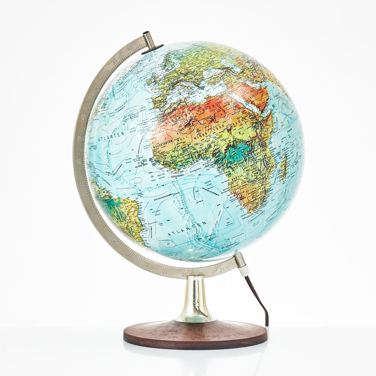 A 1970s-era globe, plastic foot, with lighting.