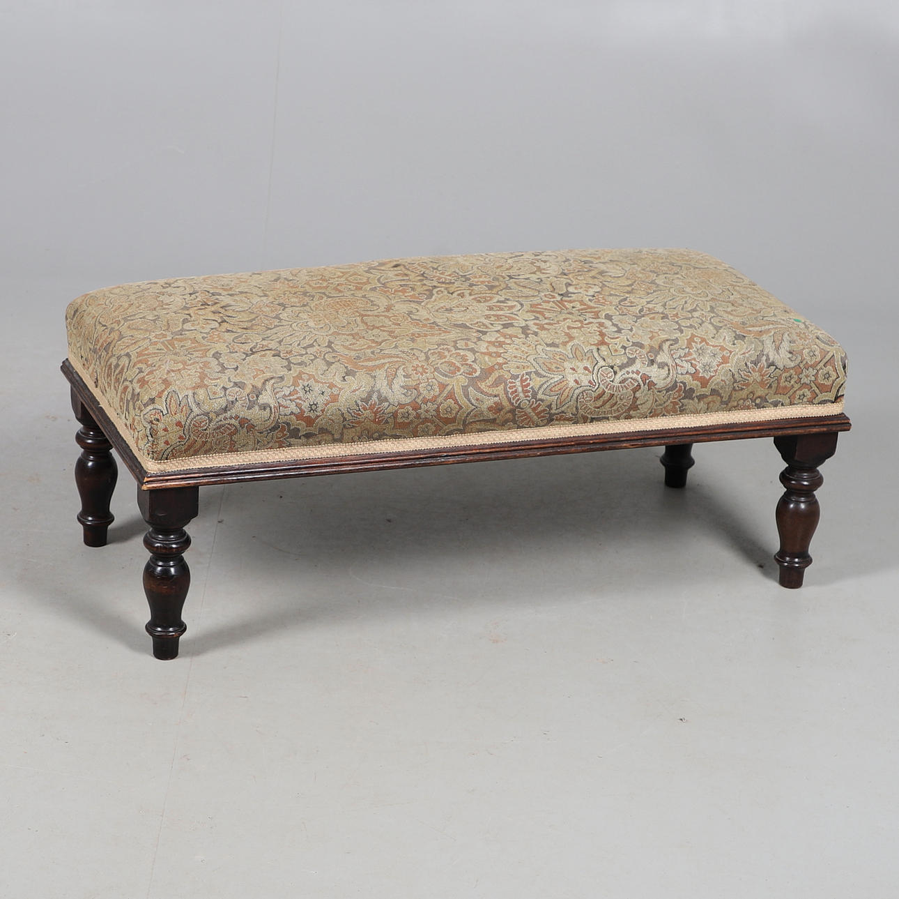A VICTORIAN RECTANGULAR UPHOLSTERED TOP STOOL.