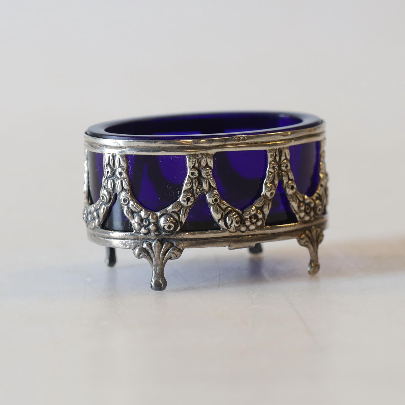 A silver salt vessel with glass insert, 20th century.