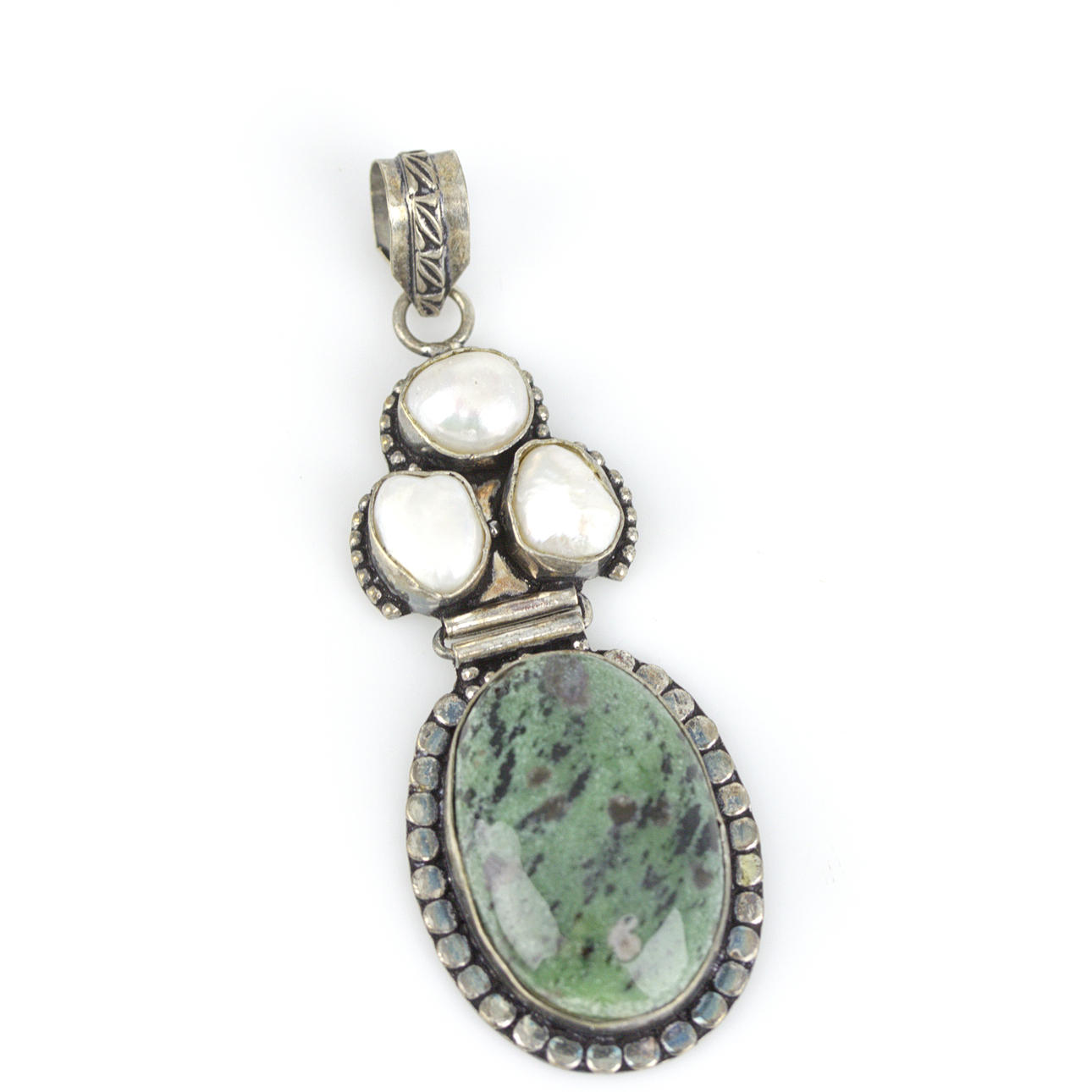 A silver pendant with cabochon-cut ruby zoisite and baroque pearls.