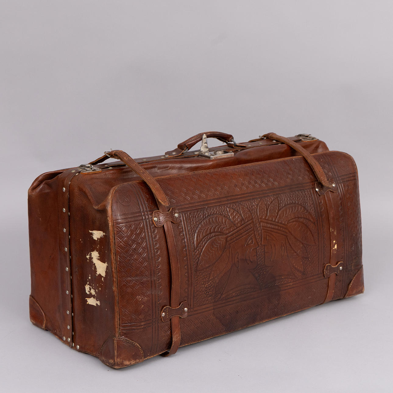 A coat sack, embossed leather, 20th century.