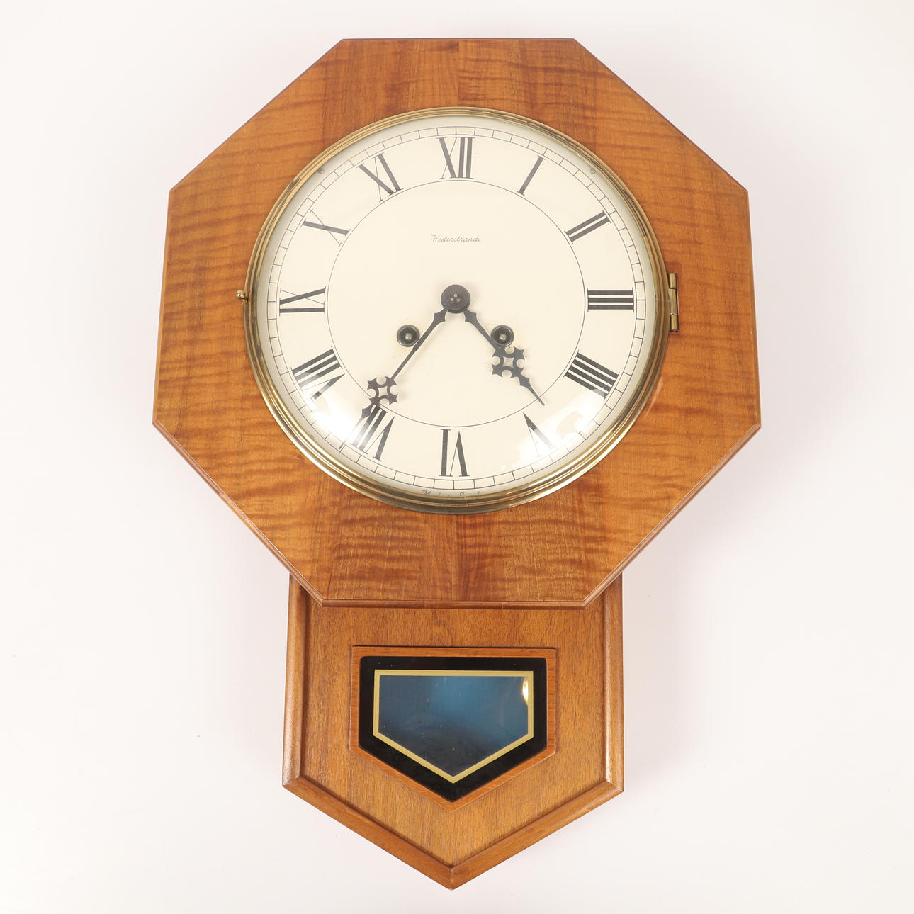 A wooden wall clock from Westerstrands, mid 20th century.