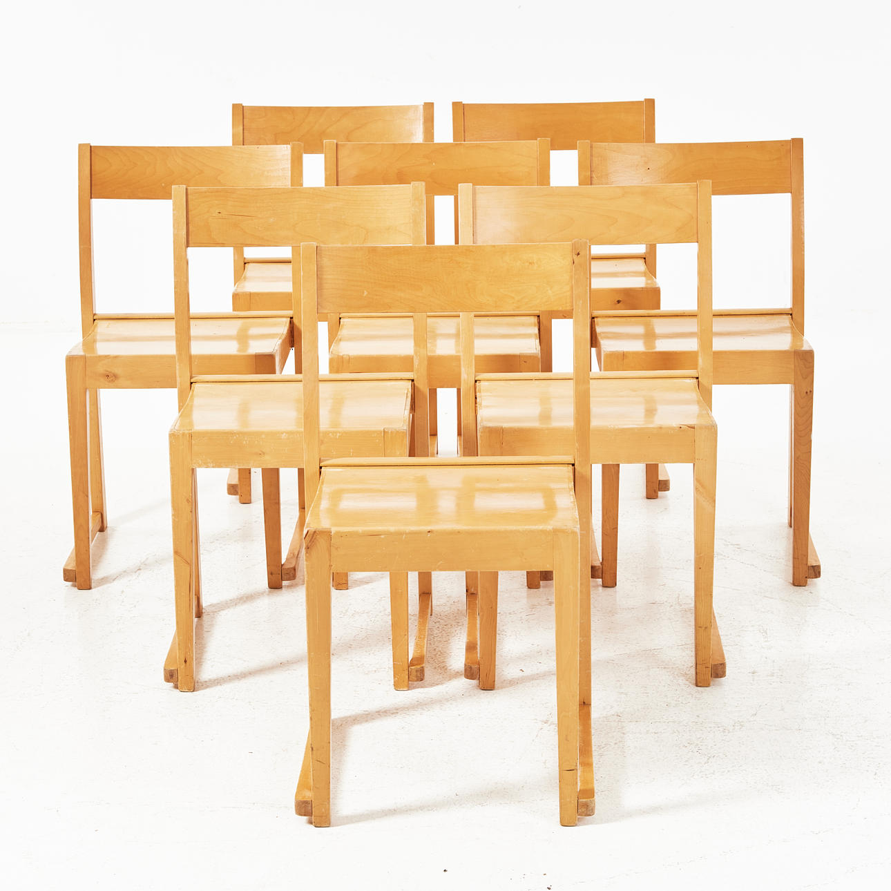 A set of 8 chairs, orchestral model, birch.