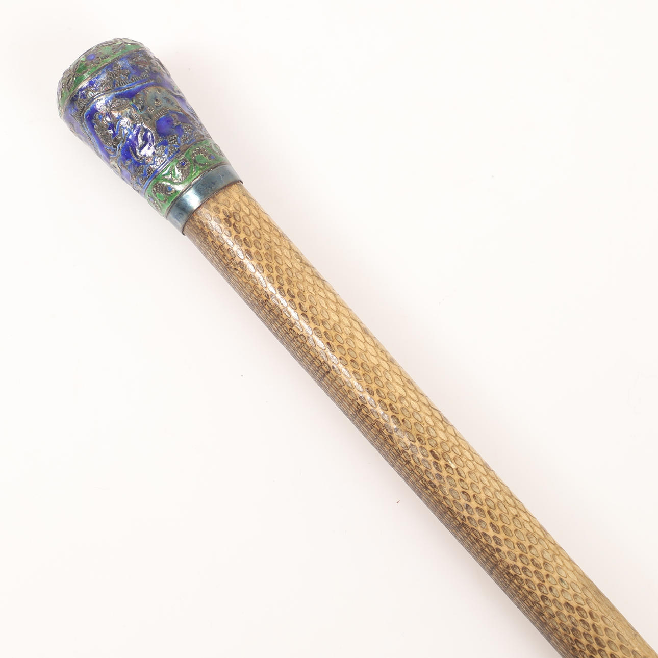 KÄPP, snakeskin-clad log with cloisonne bud.