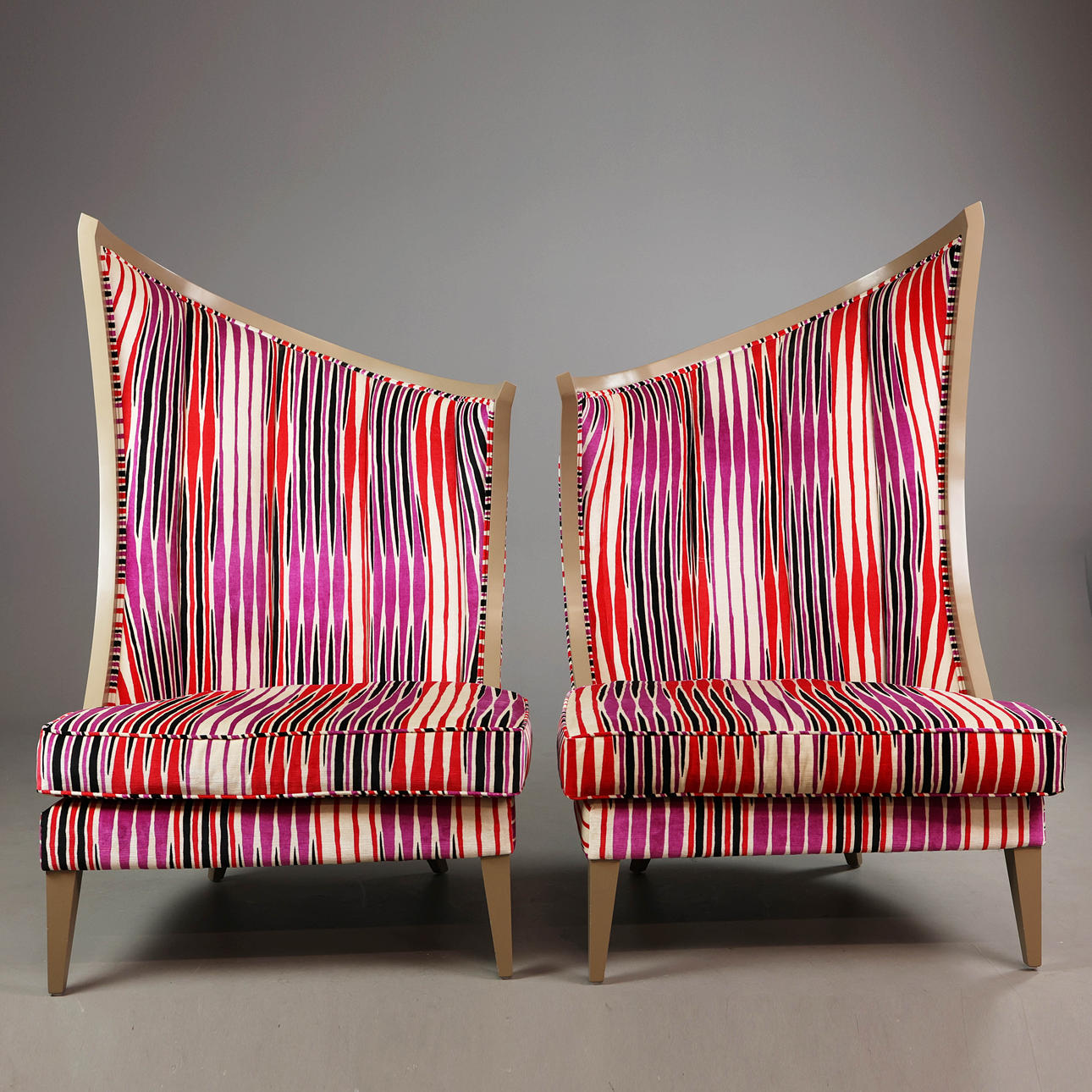 SET OF TWO CHRISTOPHER GUY STYLE "COURBURE" HIGH BACK LOUNGE CHAIRS.