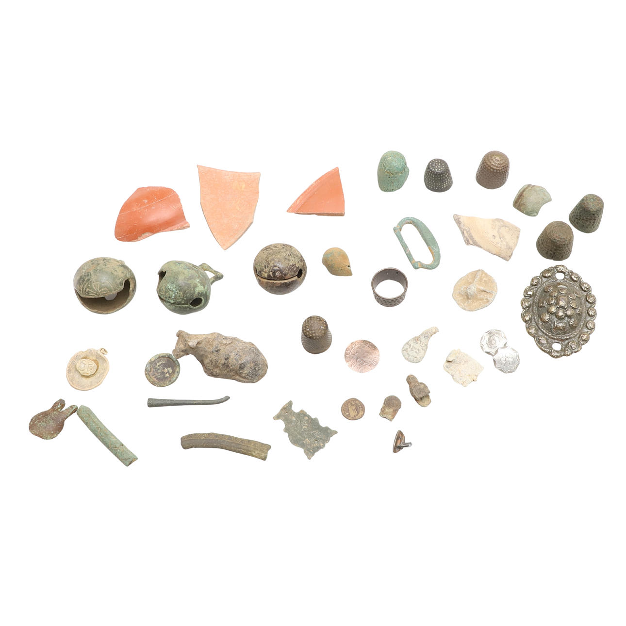 A MIXED COLLECTION OF ARTEFACTS INCLUIDING CROTAL BELLS. Silver ...