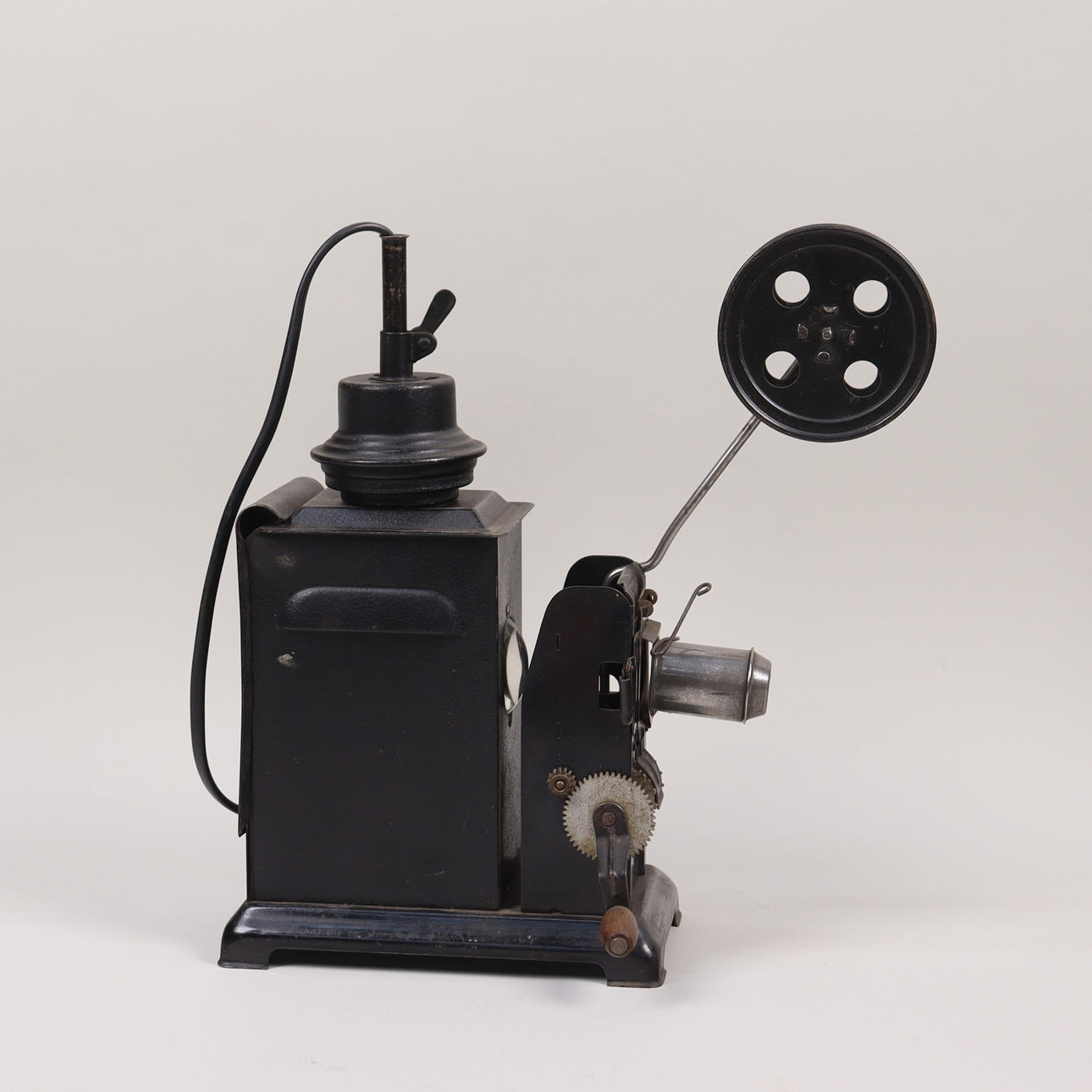 A hand-cranked film projector, first half of the 20th century ...