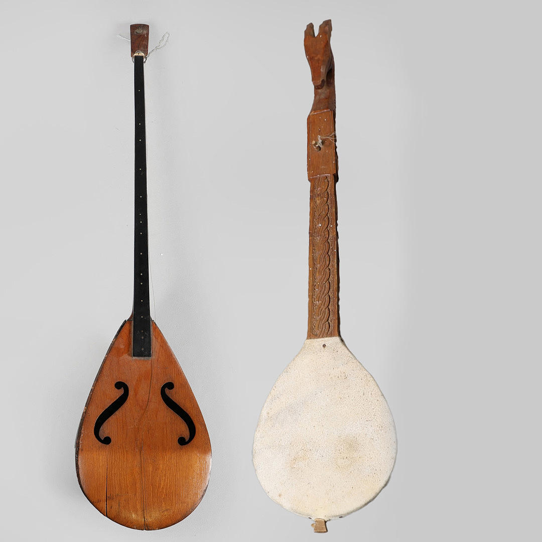 A CARVED ONE STRING GUSLE TOGETHER WITH A ONE STRING MANDOLA (2).