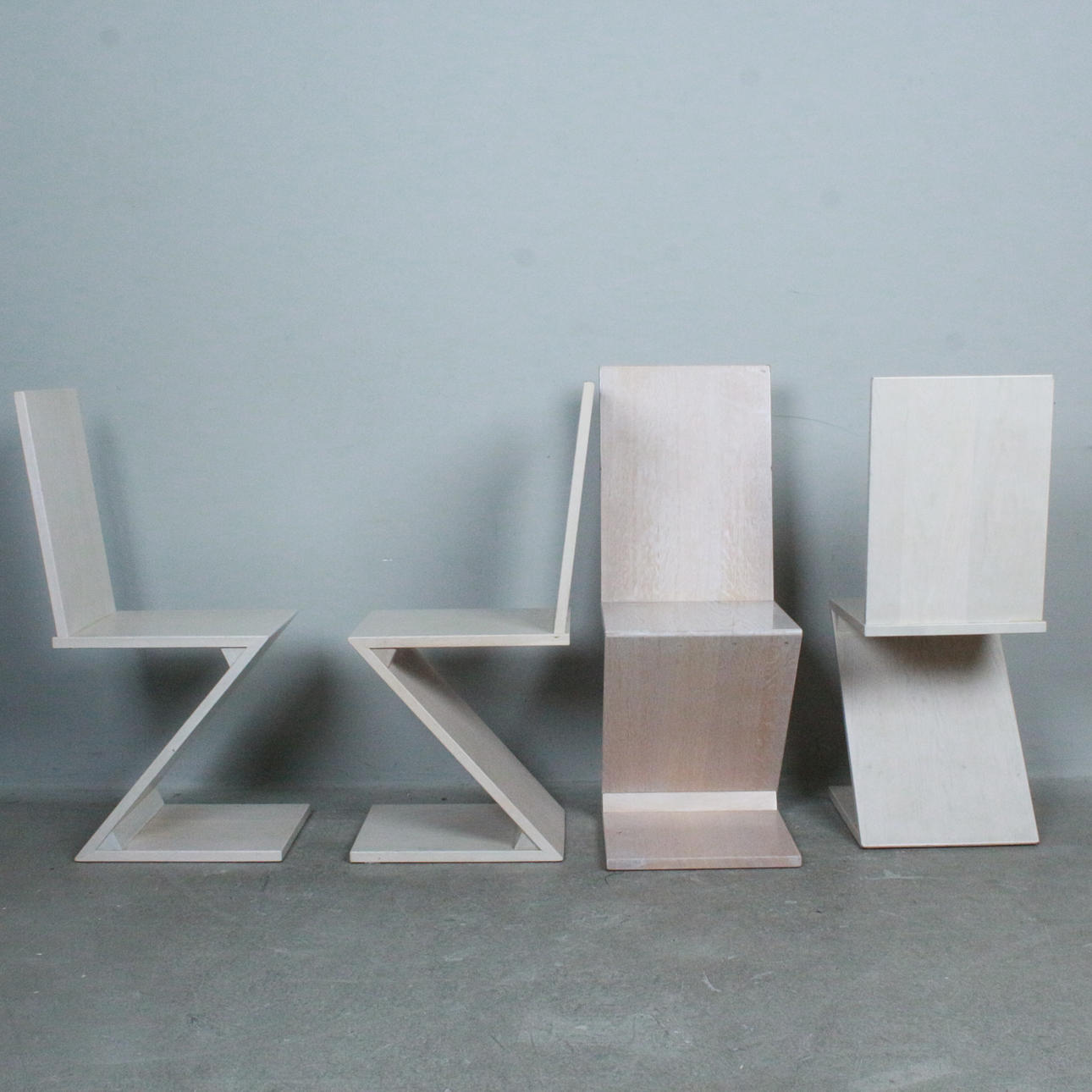 Four zig zag style dining room chairs.