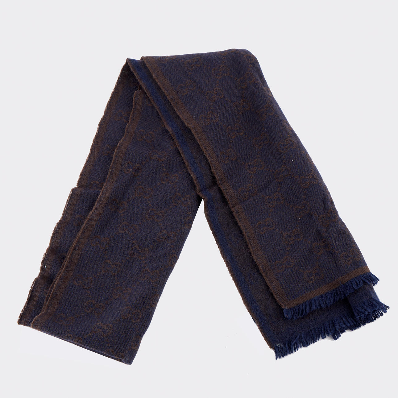 GUCCI, a monogram scarf.