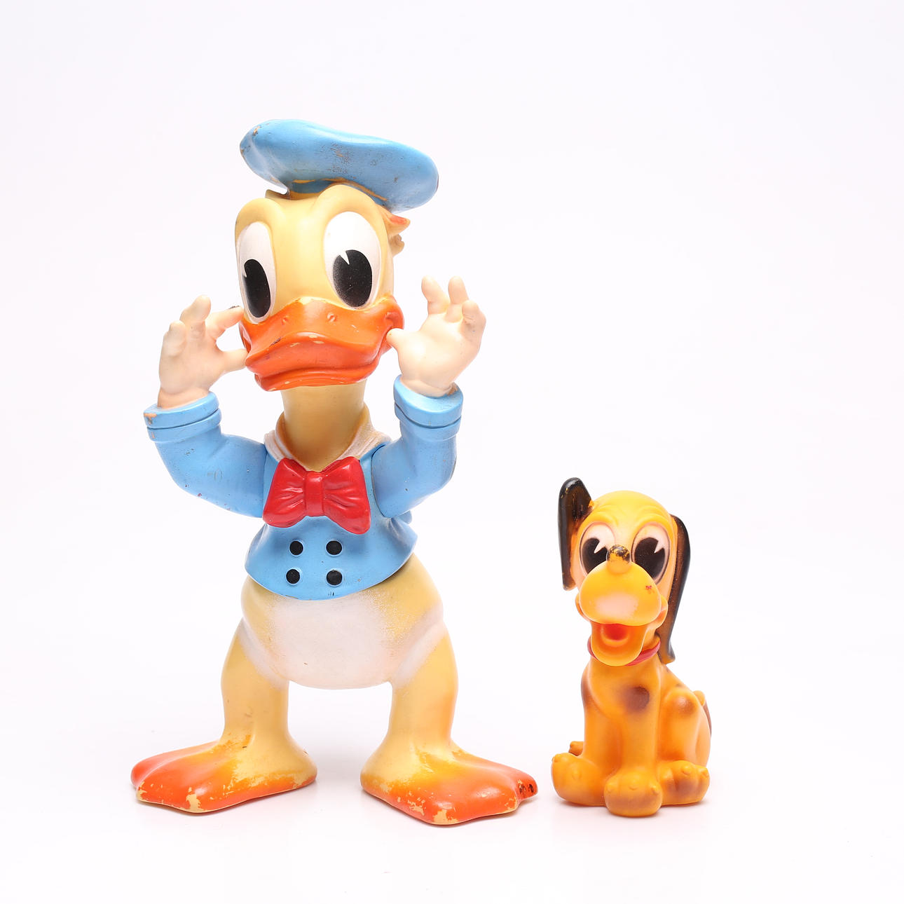 A set of 2 toys, Donald Duck and Pluto, b.la. Walt Disney Productions ...