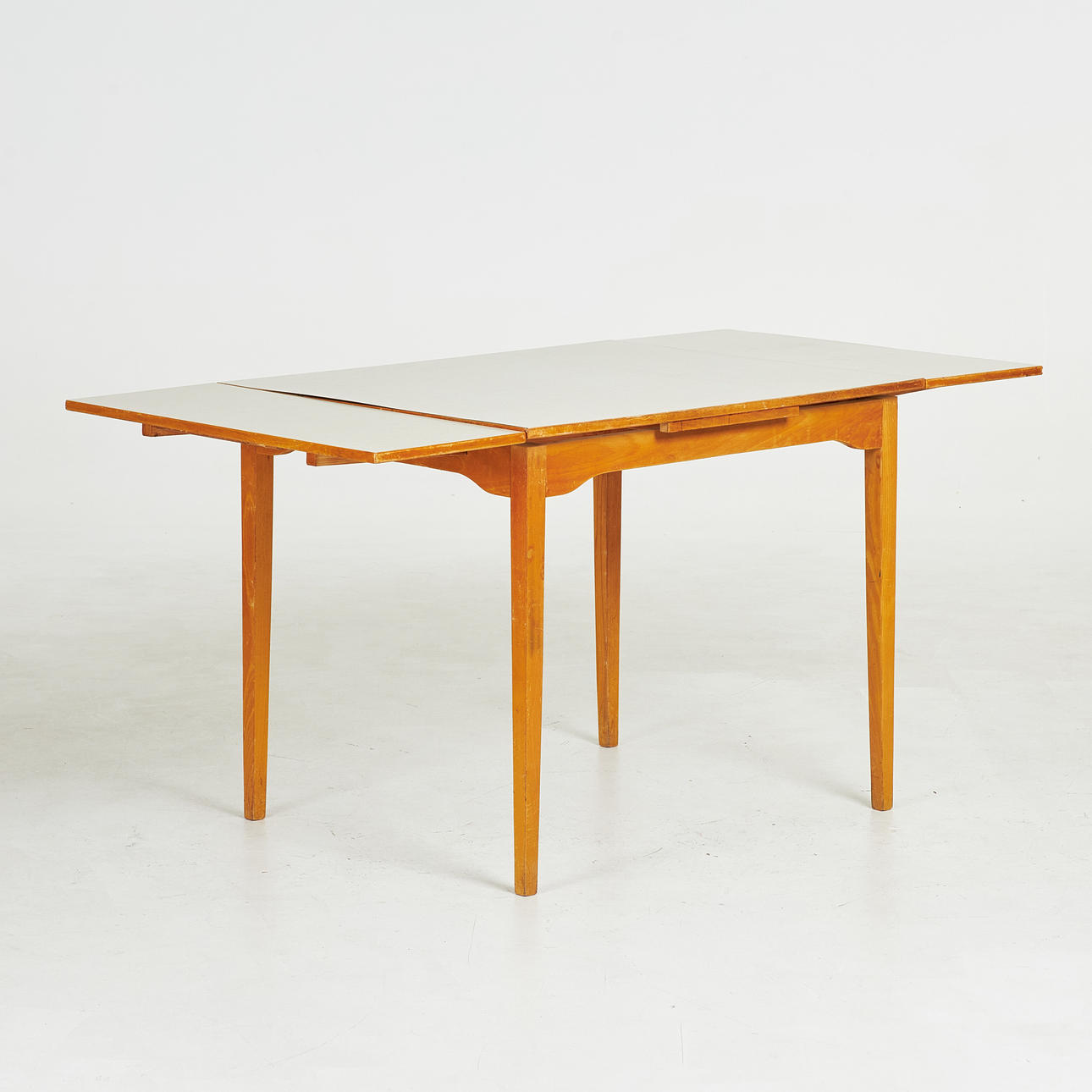 A 1950's dining table, Edsbyverk, perstorp board, 2 pull-out plates ...