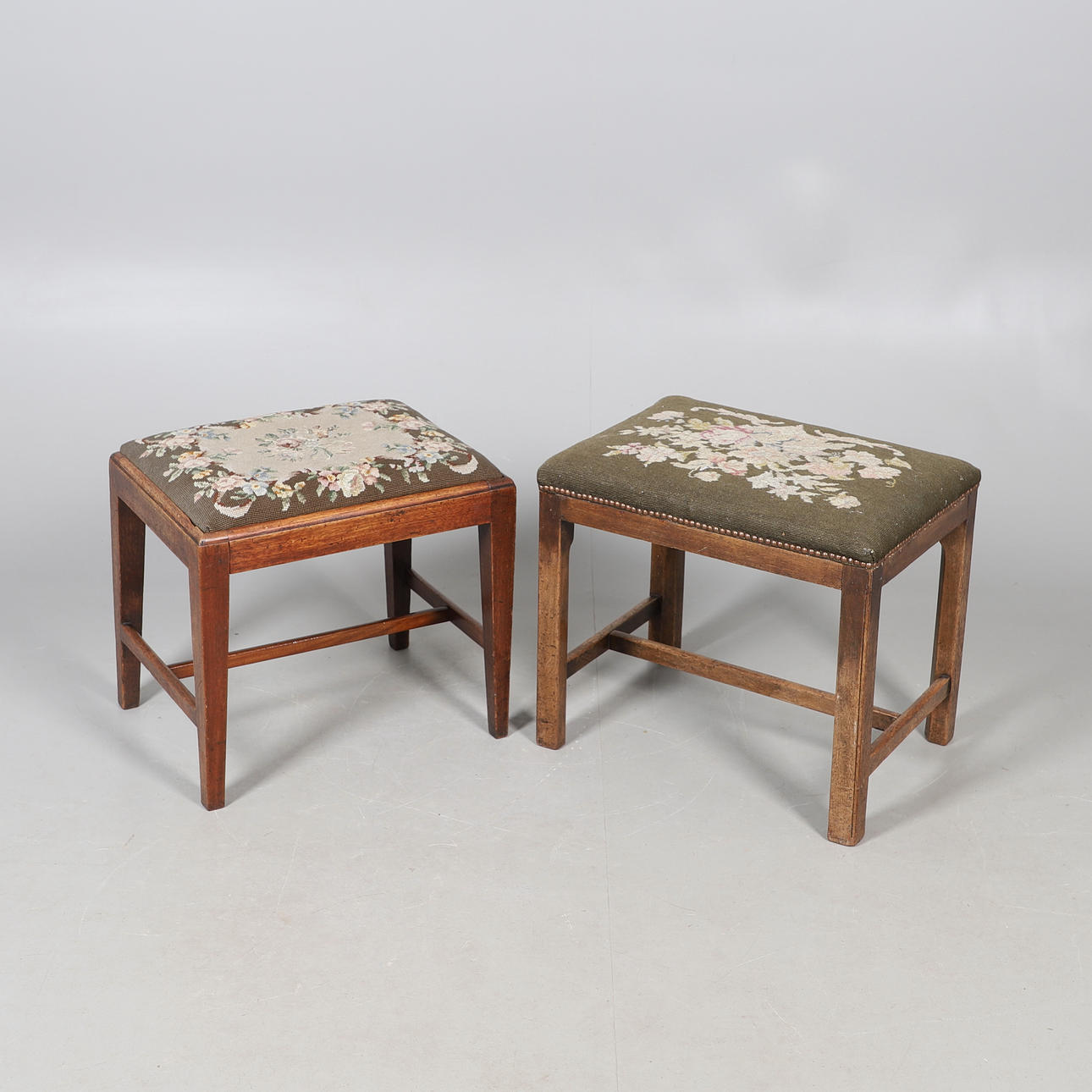 TWO 19TH CENTURY MAHOGANY TAPESTRY STOOLS.