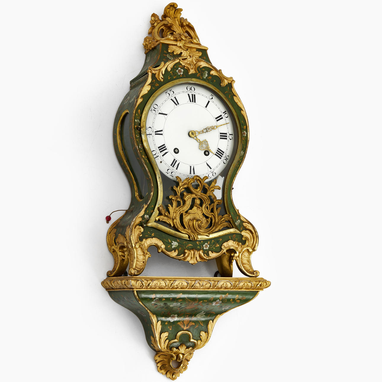 ROCOCO MID- OR THIRD-QUARTER 18TH CENTURY CONSOLE CLOCK, PAINTED, BRONZED AND GILDED WOODCUT DECORATION, DECORATIVE FITTINGS OF GILT BRASS.