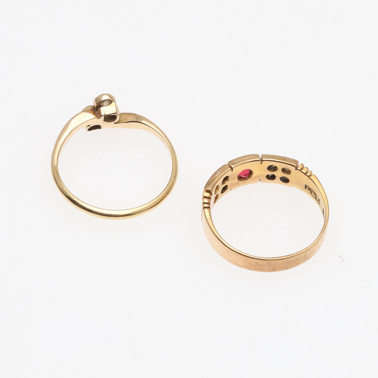 AN 18CT GOLD AND DIAMOND CROSSOVER RING AND A 15CT GOLD RING. Jewellery ...