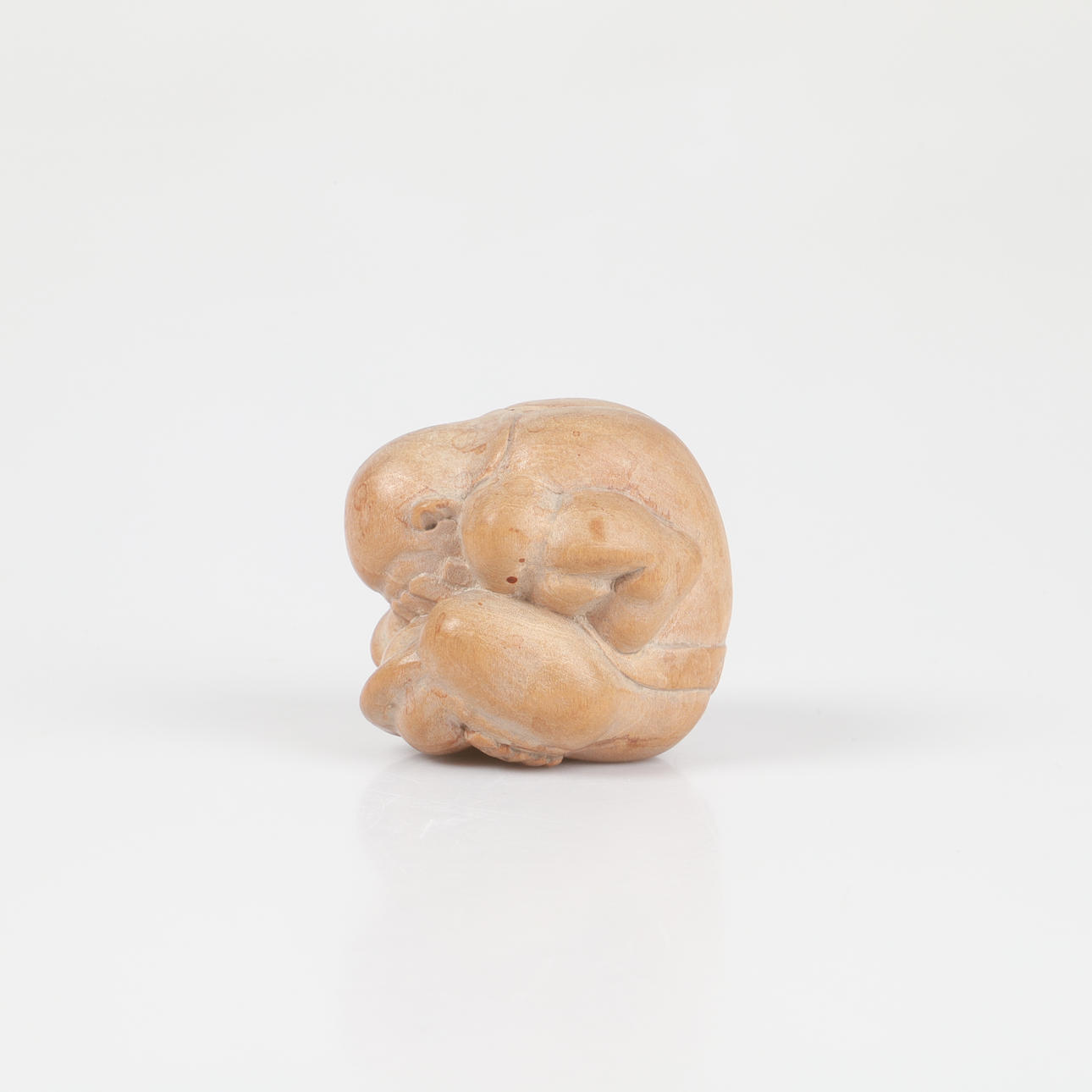 FIGURINE, weeping Buddha, wood.