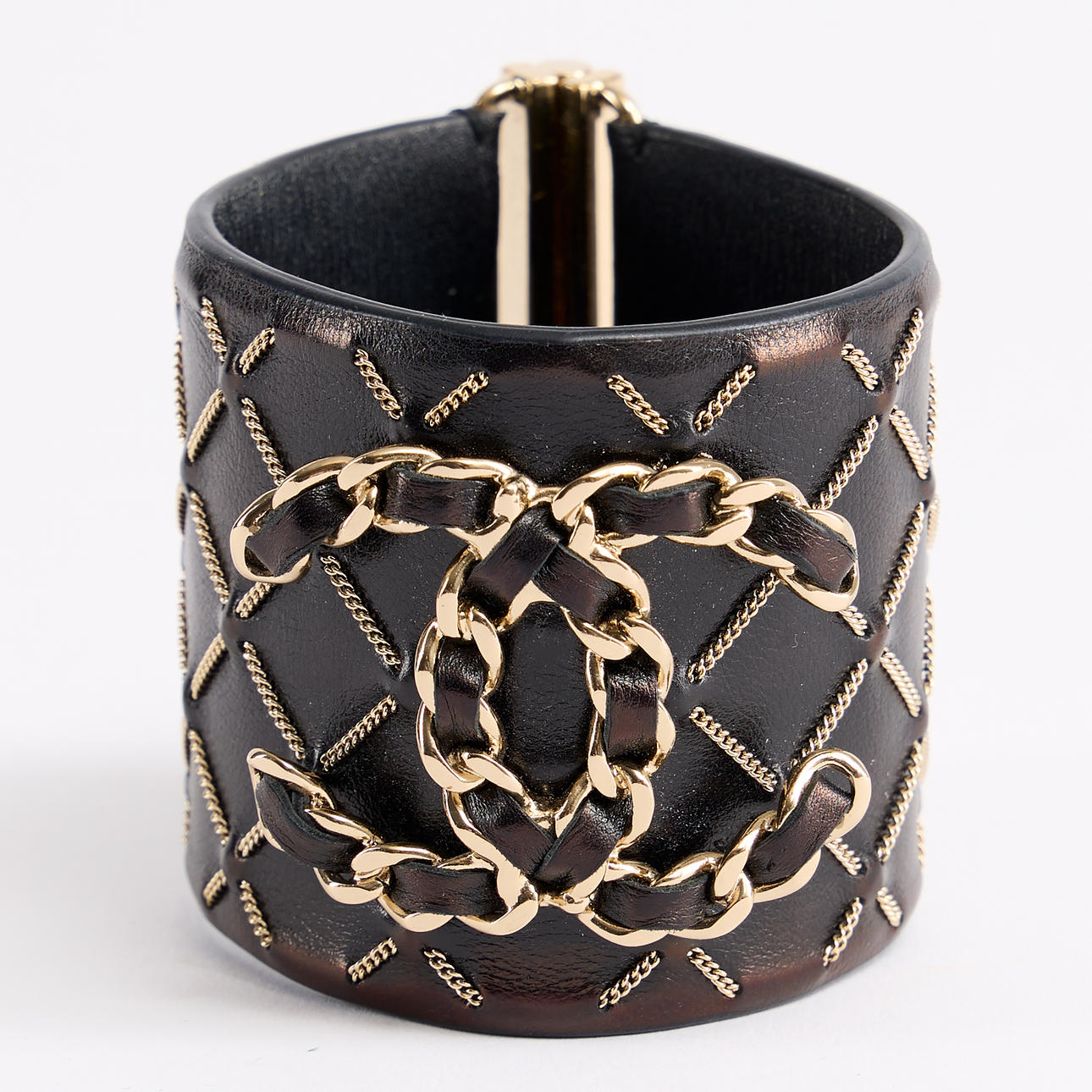 CHANEL, bracelet, black leather with monograms and chains.
