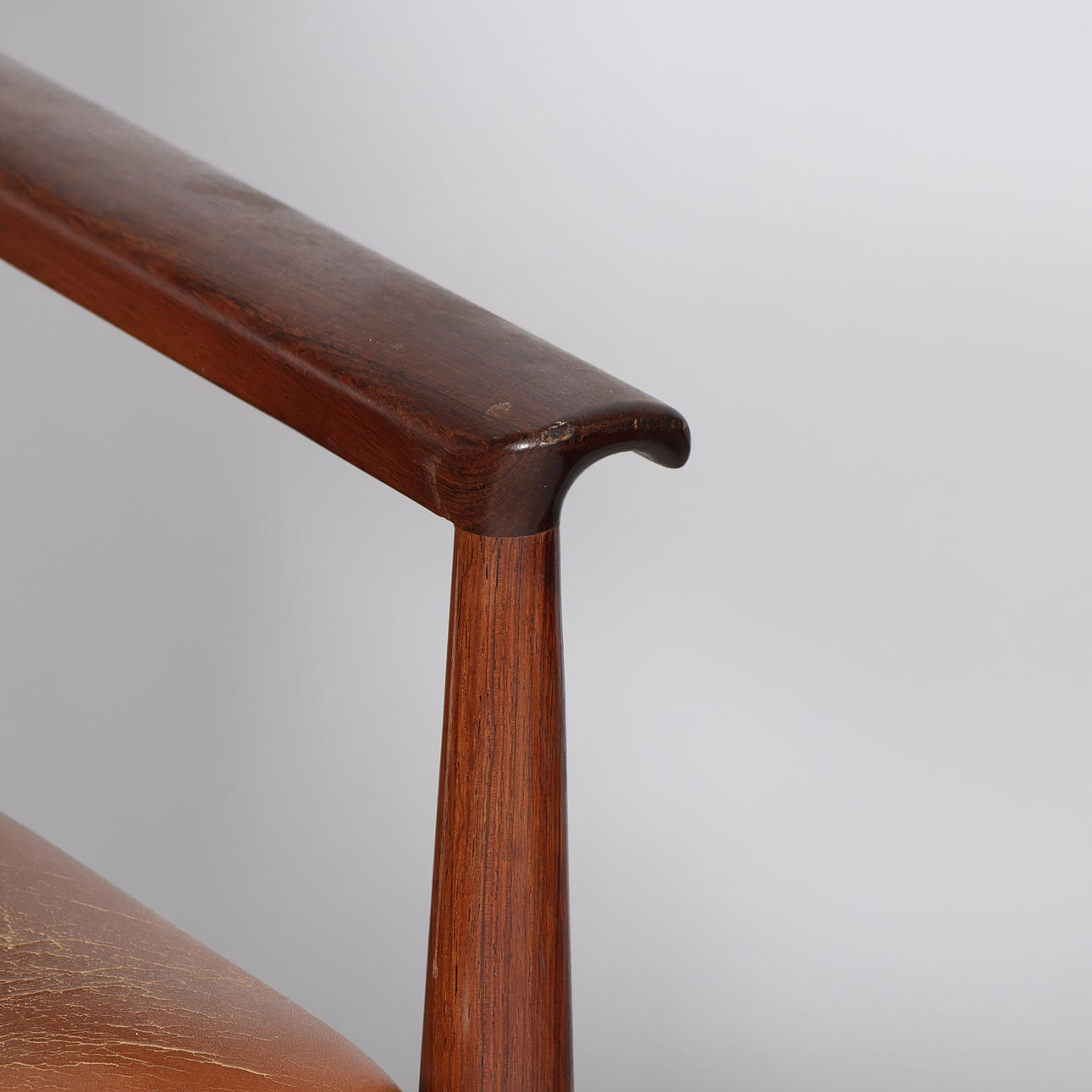 FINN JUHL. A pair of “Diplomat” armchairs, rosewood frame, seat and ...