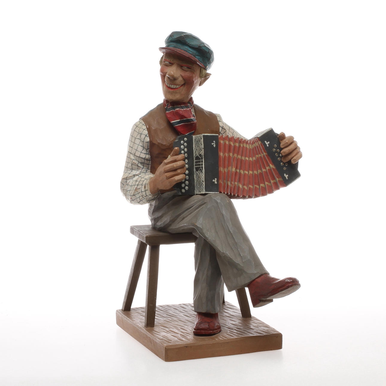 HERMAN ROSELL. Tillskriven, skulptur, skuret och bemålat trä, man med dragspel, 1900-tal.