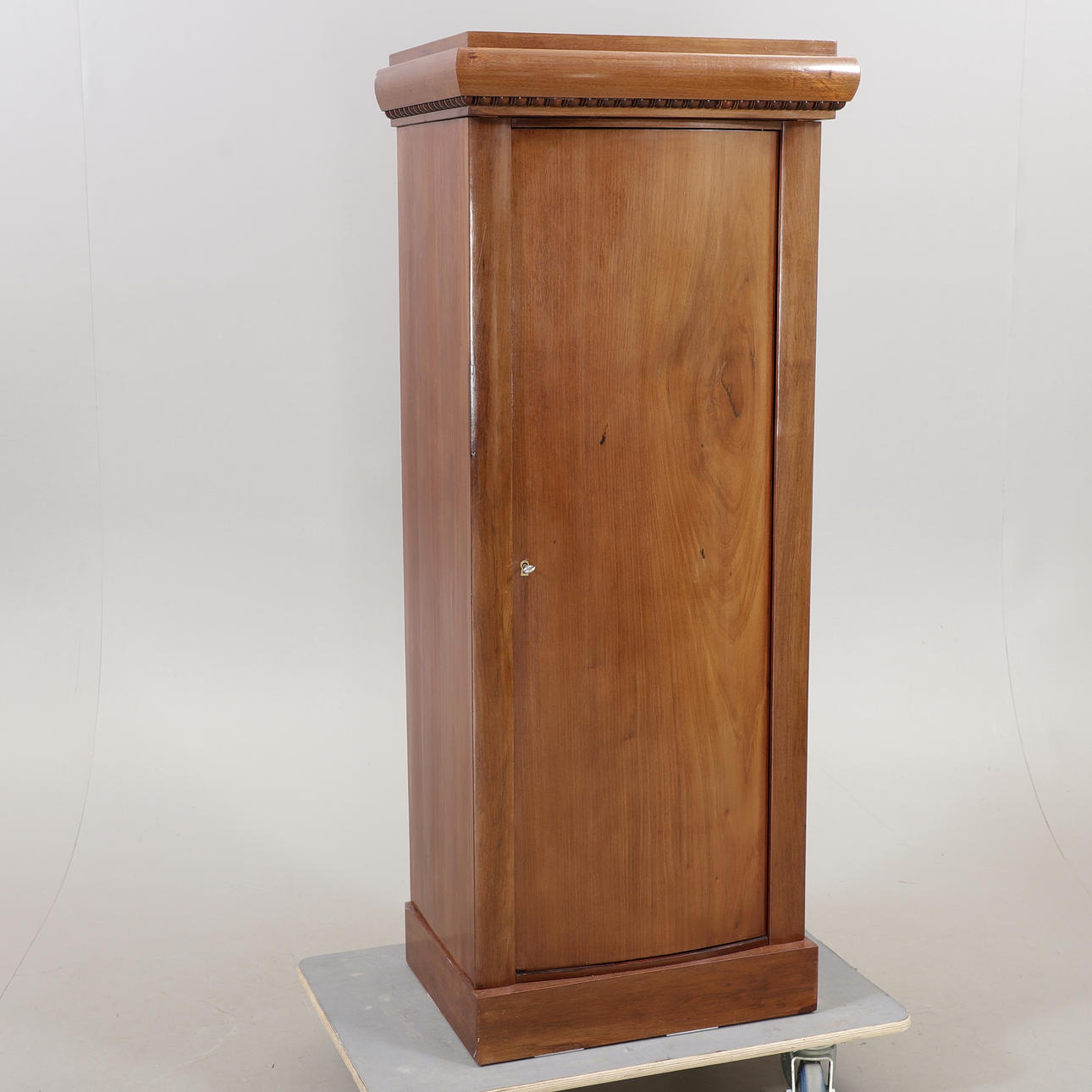A walnut column cabinet, Denmark, first half of the 20th century ...