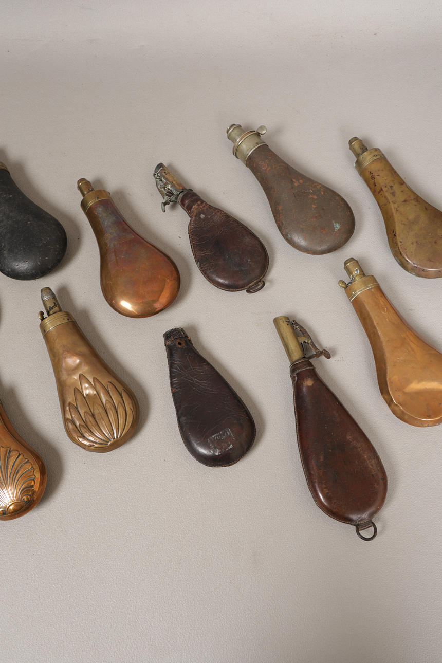 A COLLECTION OF SIXTEEN 19TH CENTURY AND LATER POWDER & SHOT FLASKS (16 ...