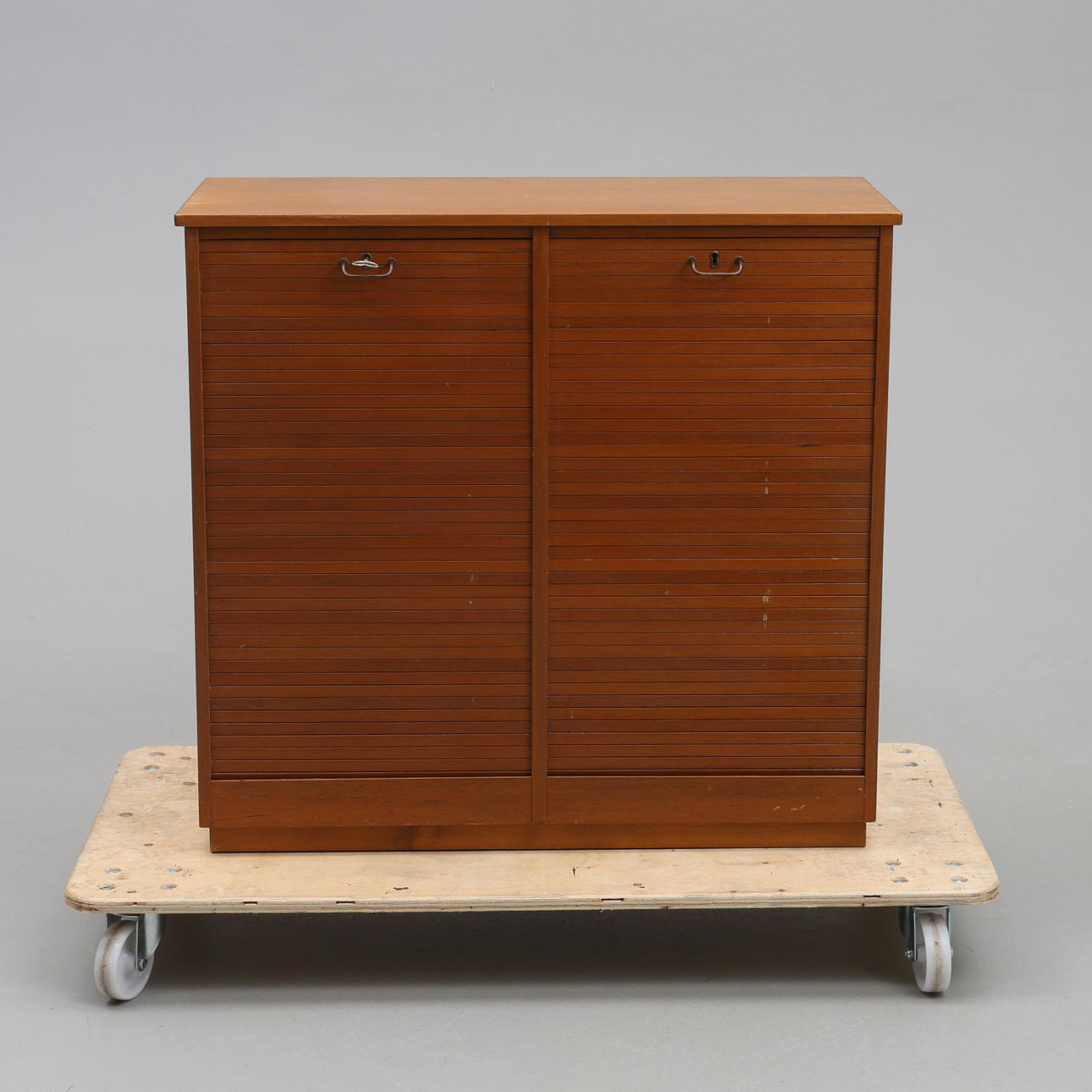 A mid 20th century birch filing cabinet with blinds.