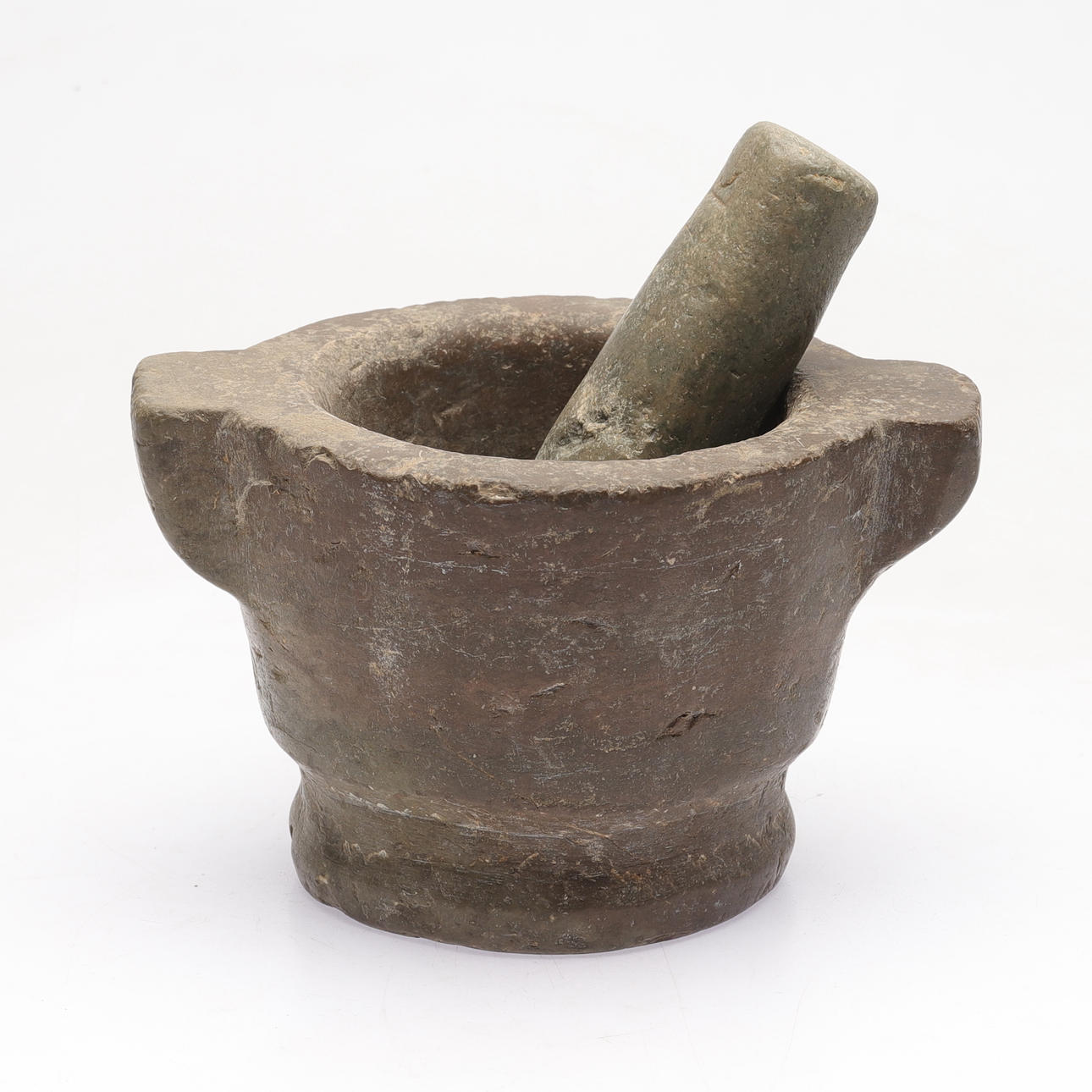 A limestone mortar with pestle, 18th century.